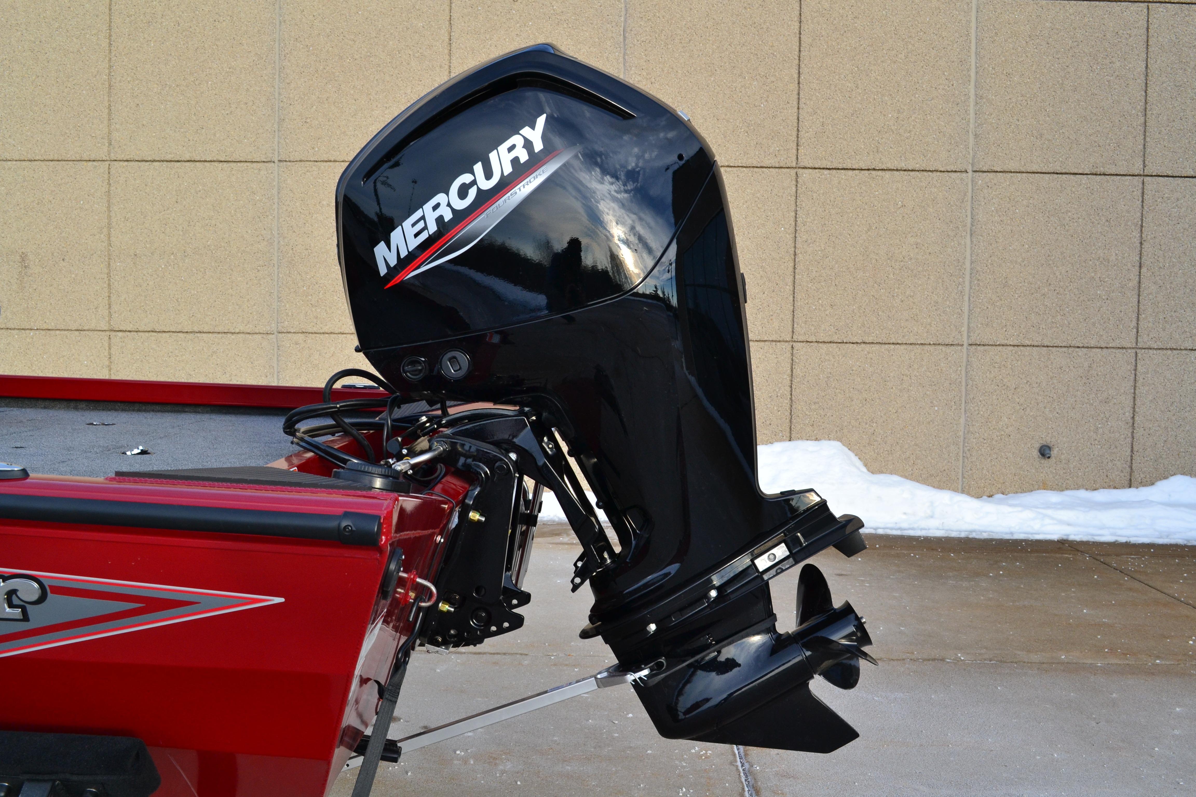 2026 Ranger RT188 boat with Mercury outboard motor, parked on snowy pavement.