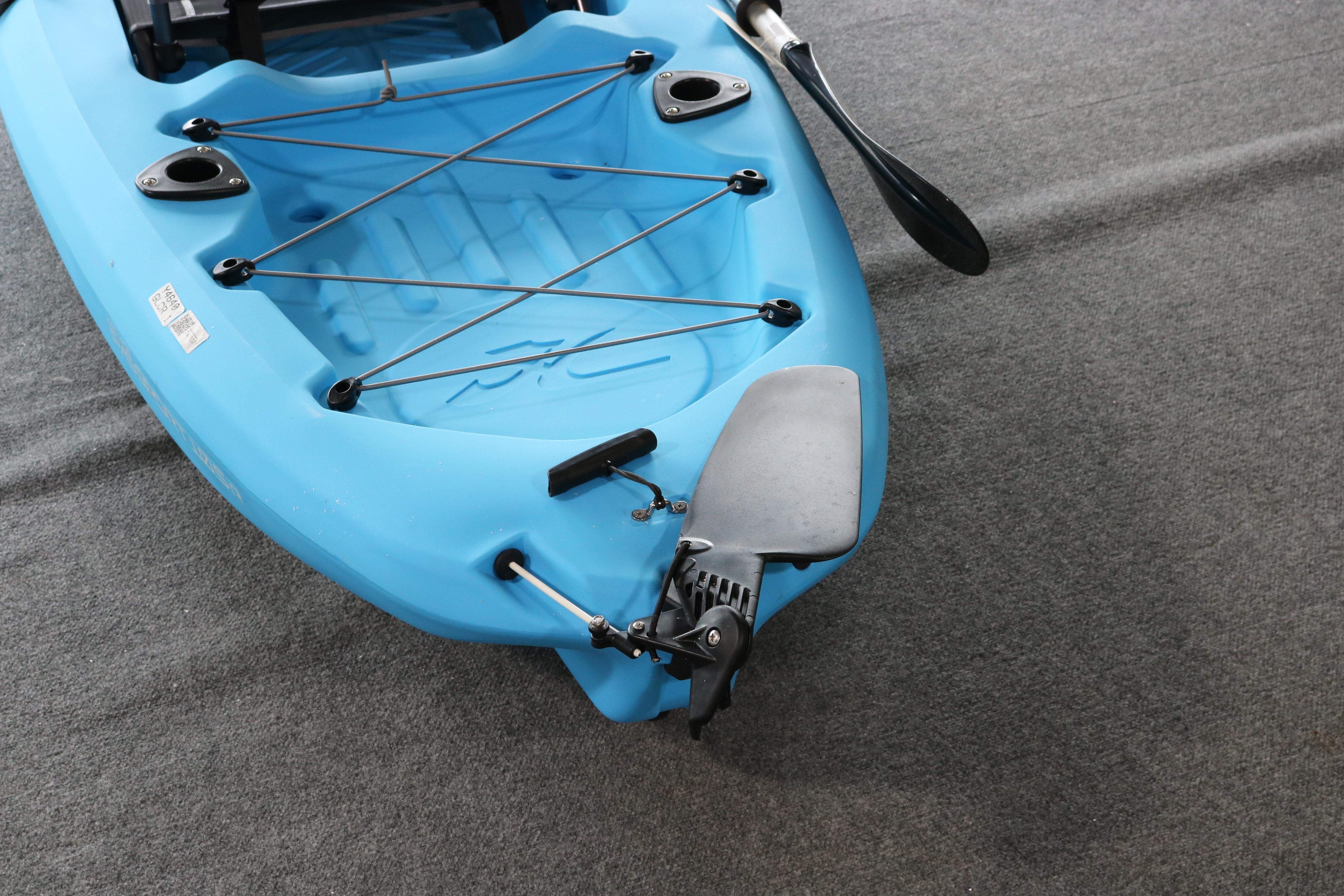 2024 Hobie Mirage Passport 10.5 R kayak, blue, with paddle and rudder system.