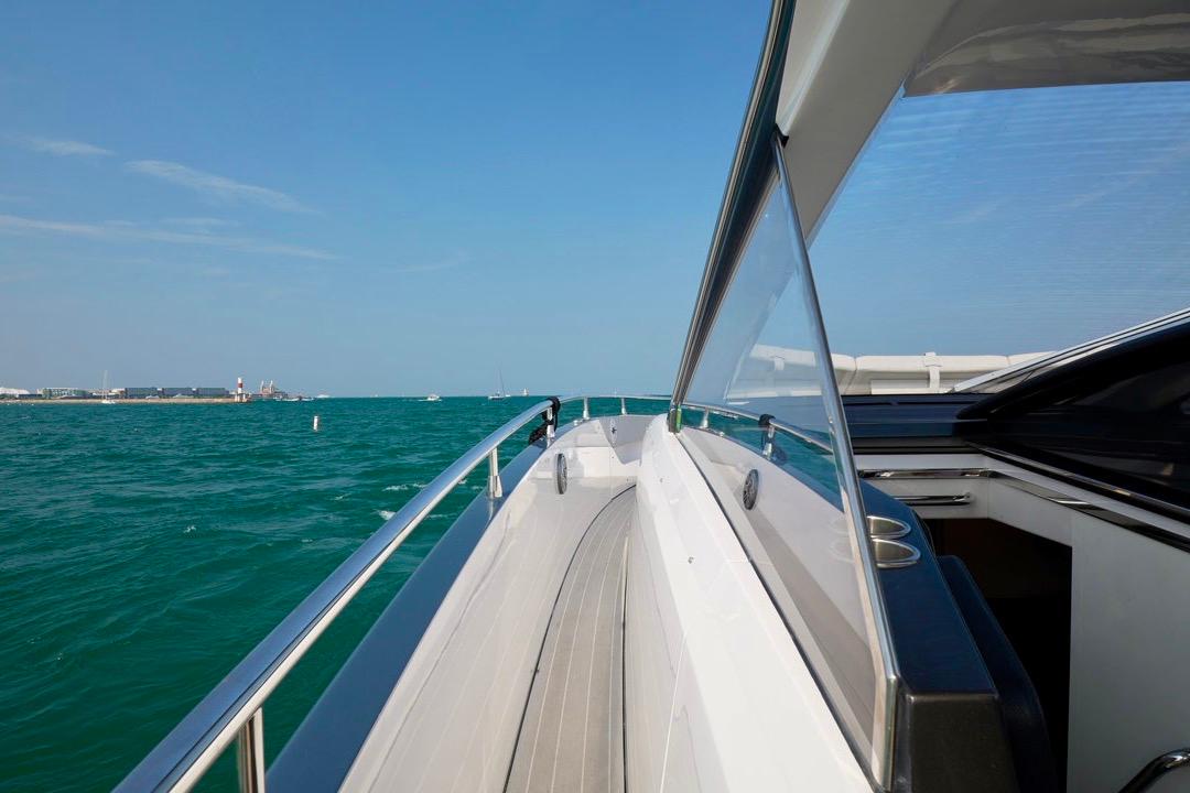 2024 Azimut Verve 48 yacht cruising on open water, showcasing sleek design and luxury.
