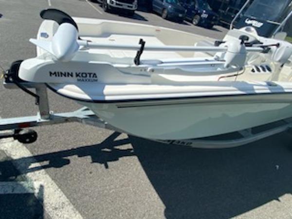 2024 Mako Pro Skiff 15 CC with Minn Kota motor on trailer in parking lot.