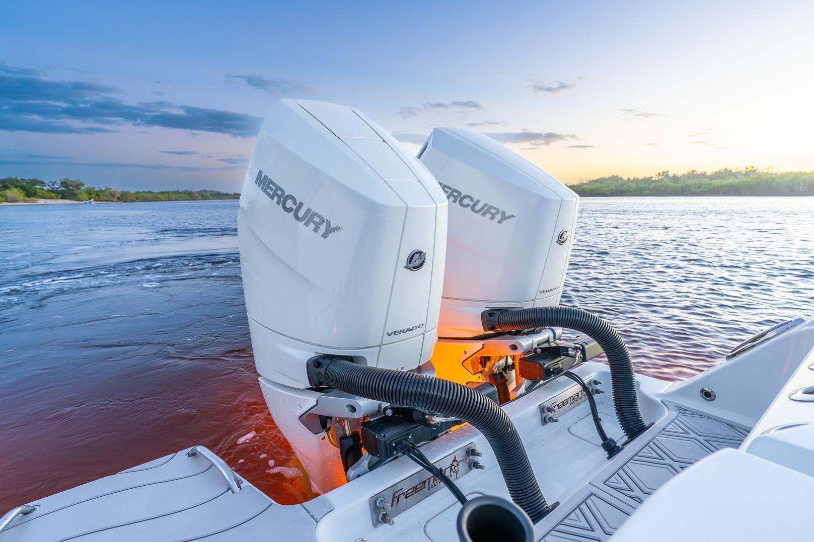 Freeman 43 boat with dual Mercury outboard engines at sunset, 2025 model.
