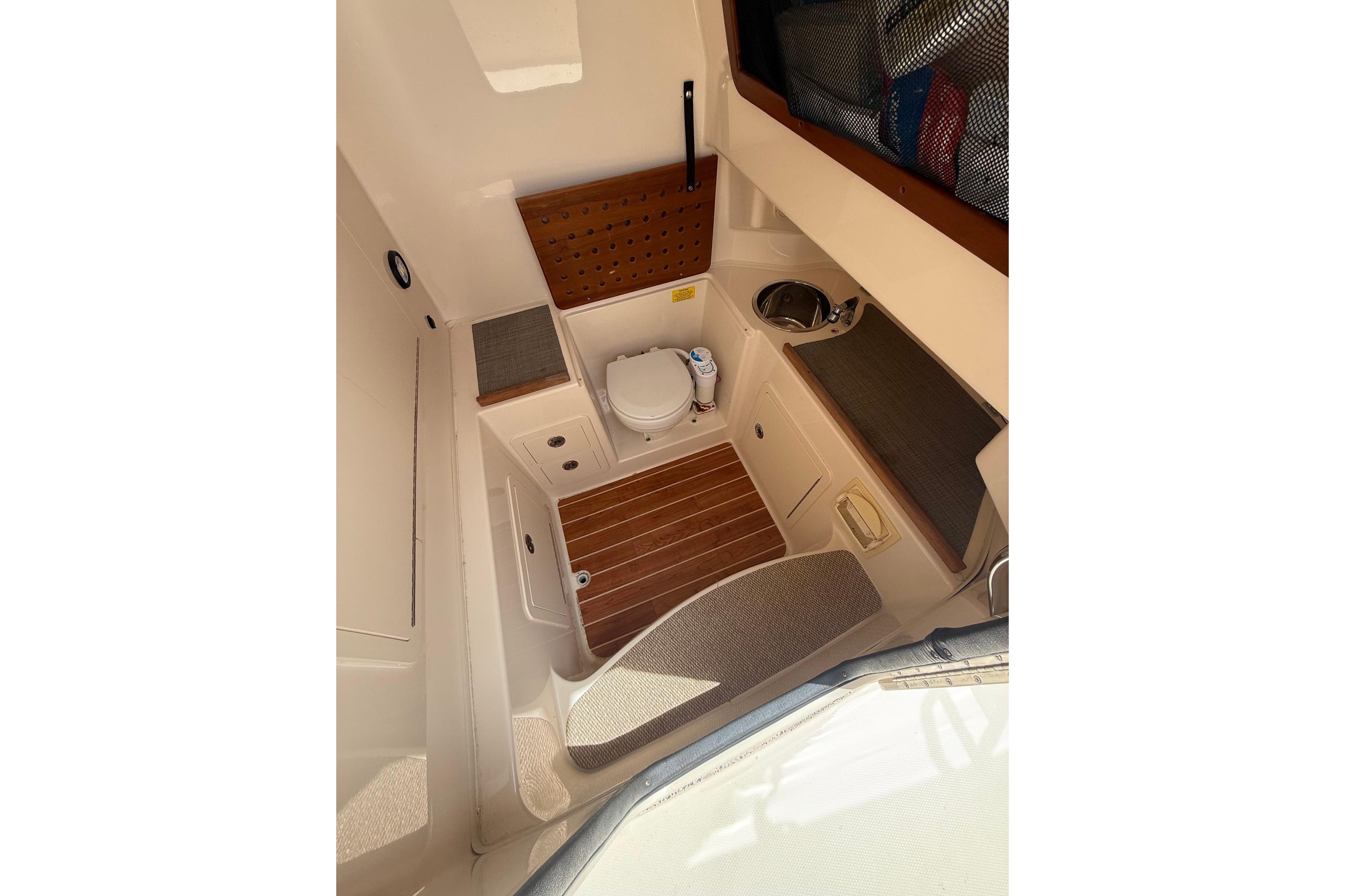 2018 Grady-White Canyon 306 boat interior with toilet and sink.