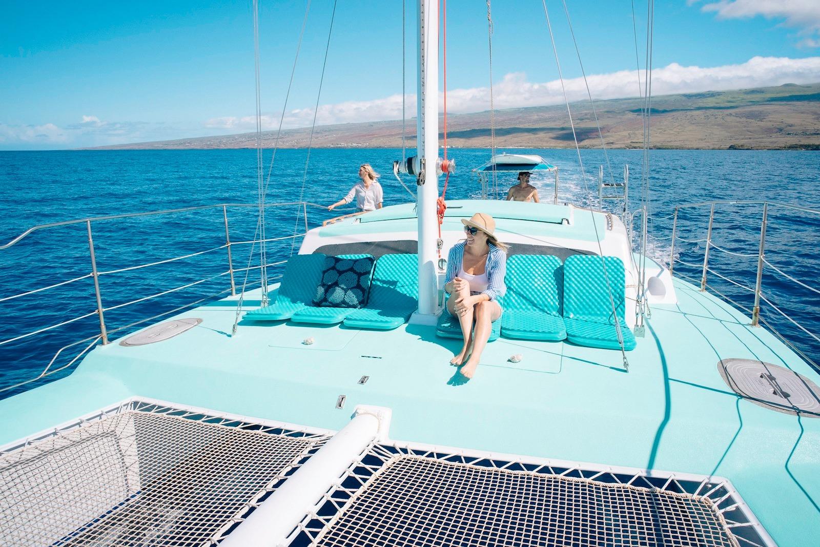 1978 CSK Beach Catamaran sailing with passengers enjoying sunny ocean views.