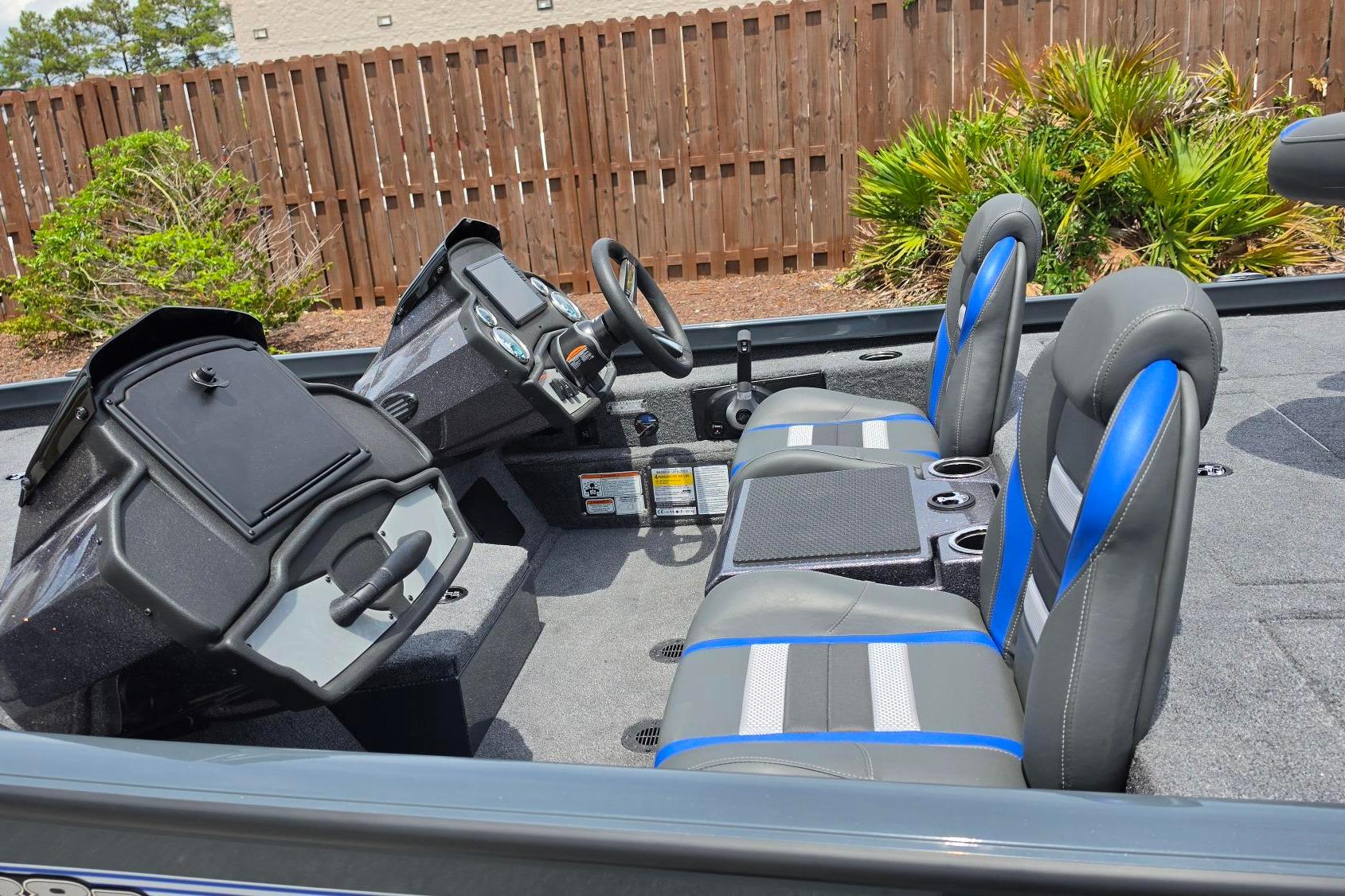 2026 Ranger RT188P boat interior with dual consoles and blue-accented seats.