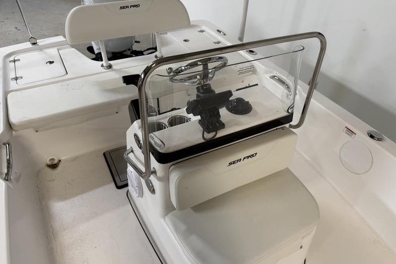 2026 Sea Pro 172 Bay boat interior with steering console and seating.
