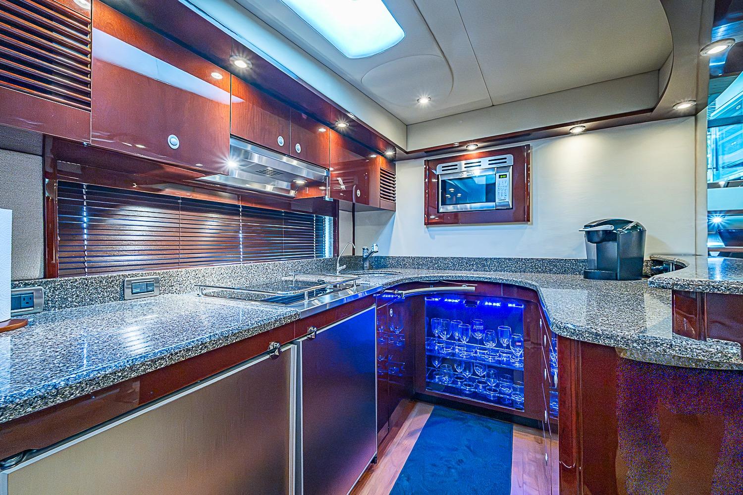 Luxurious kitchen interior of 2008 Sea Ray 60 Sundancer yacht with modern amenities.