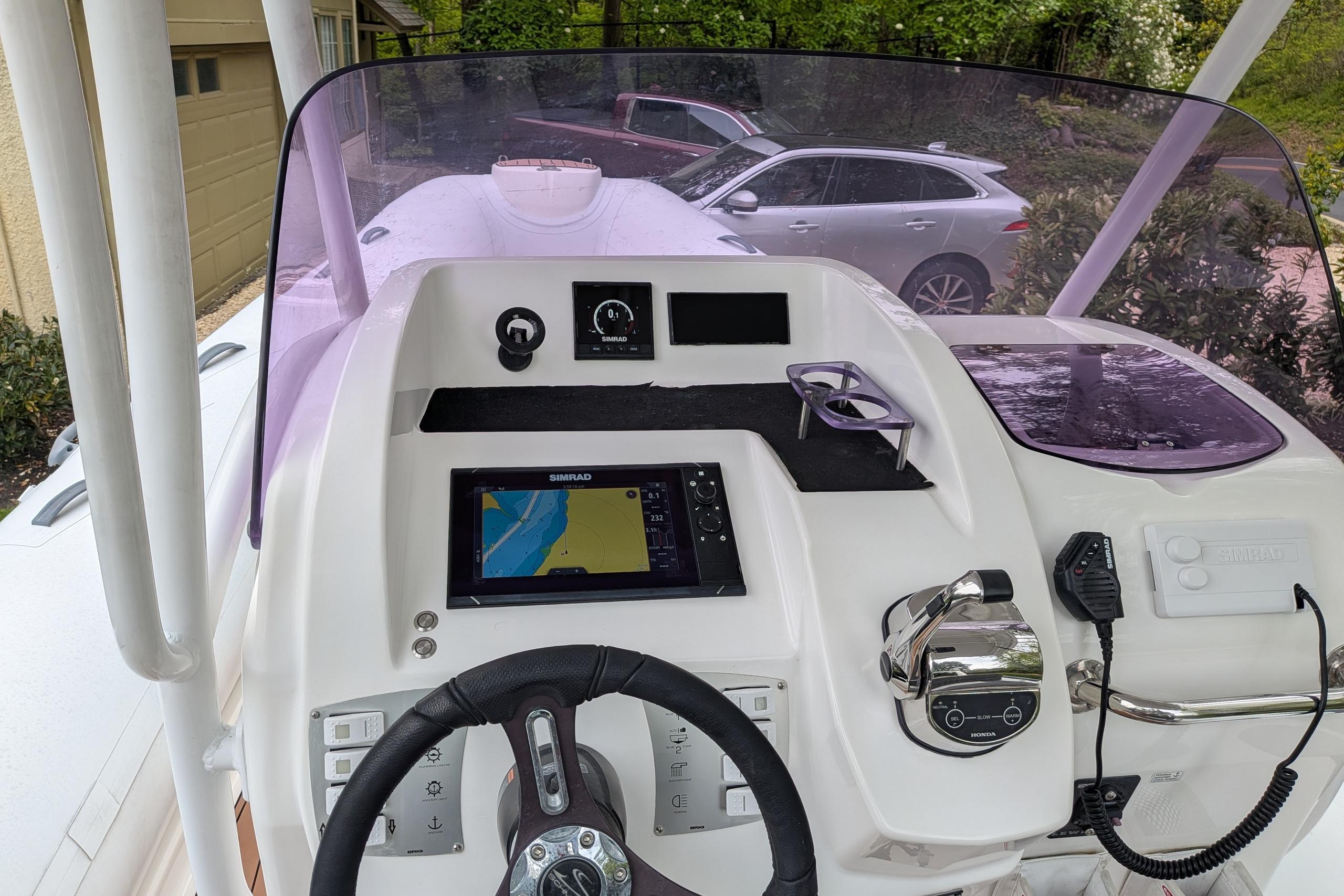 2016 Brig E780 boat dashboard with navigation system and steering wheel.