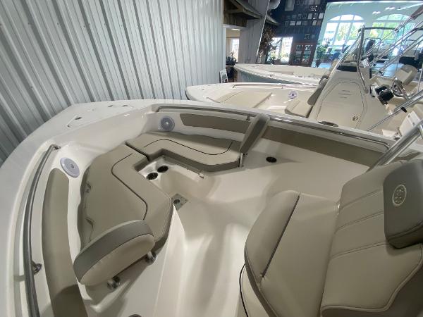 2024 Key West 203 FS boat interior with beige seating and white deck.