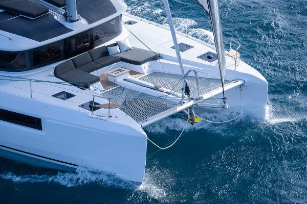 2025 Lagoon 51 ICONIC catamaran sailing on blue ocean waters.