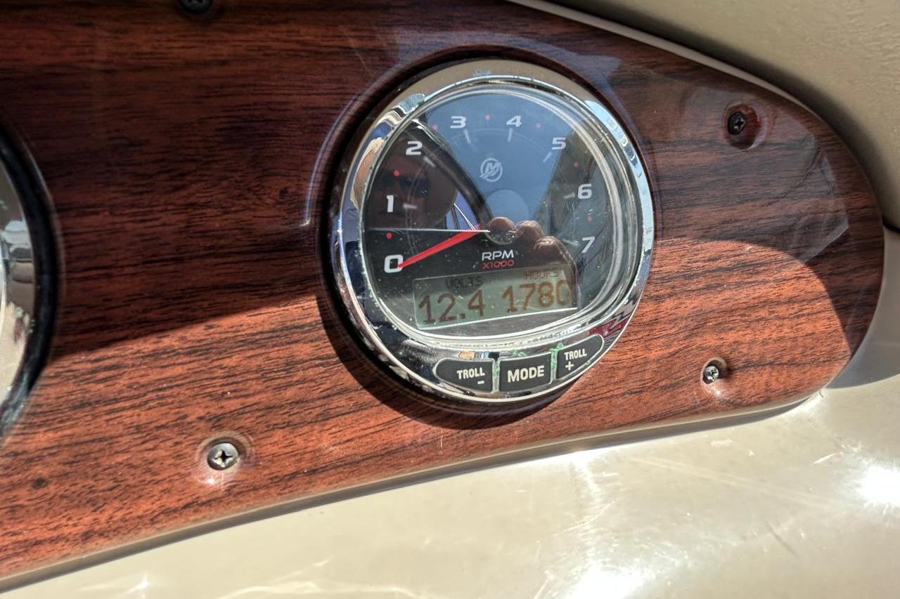 Tachometer on 2007 Sea Ray 240 Sundeck dashboard, displaying RPM and hours.