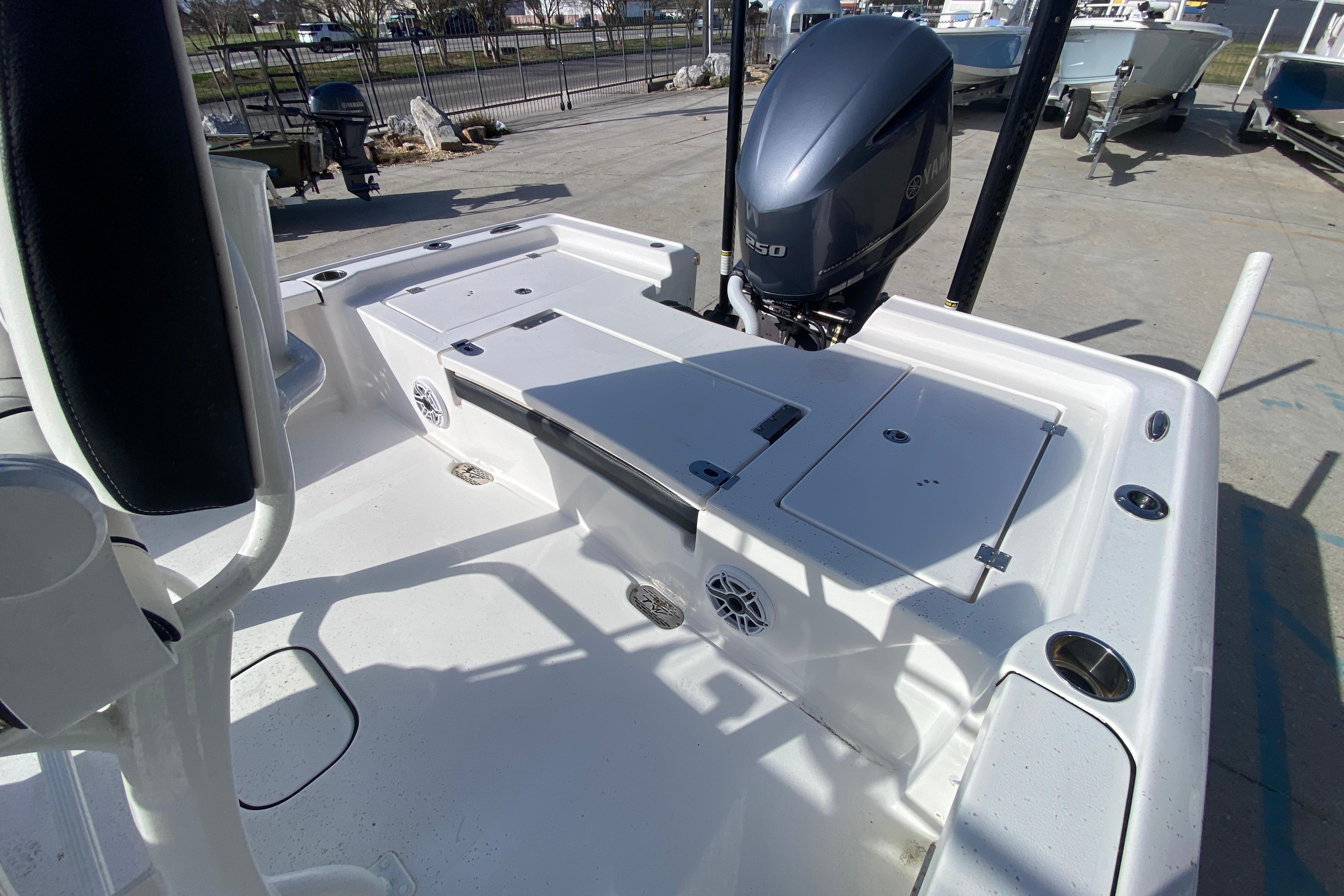 2023 Tidewater 2410 Bay Max boat with Yamaha engine, spacious deck, and storage compartments.
