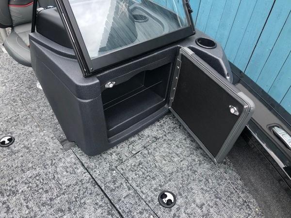 2025 Tracker Targa V18 Combo boat interior storage compartment with open door.