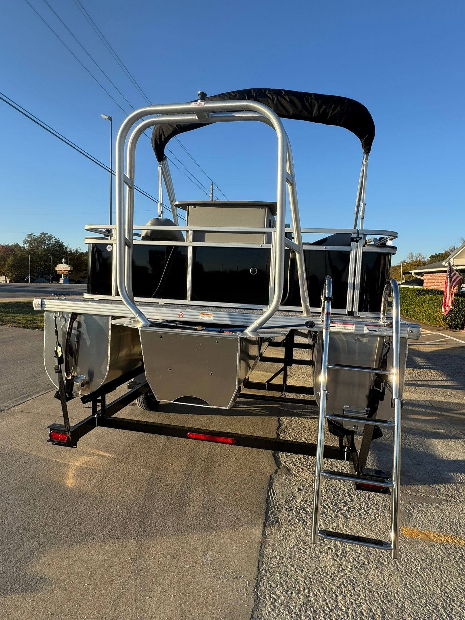 Rear view of 2026 Landau Alure 21CC Fish on trailer.