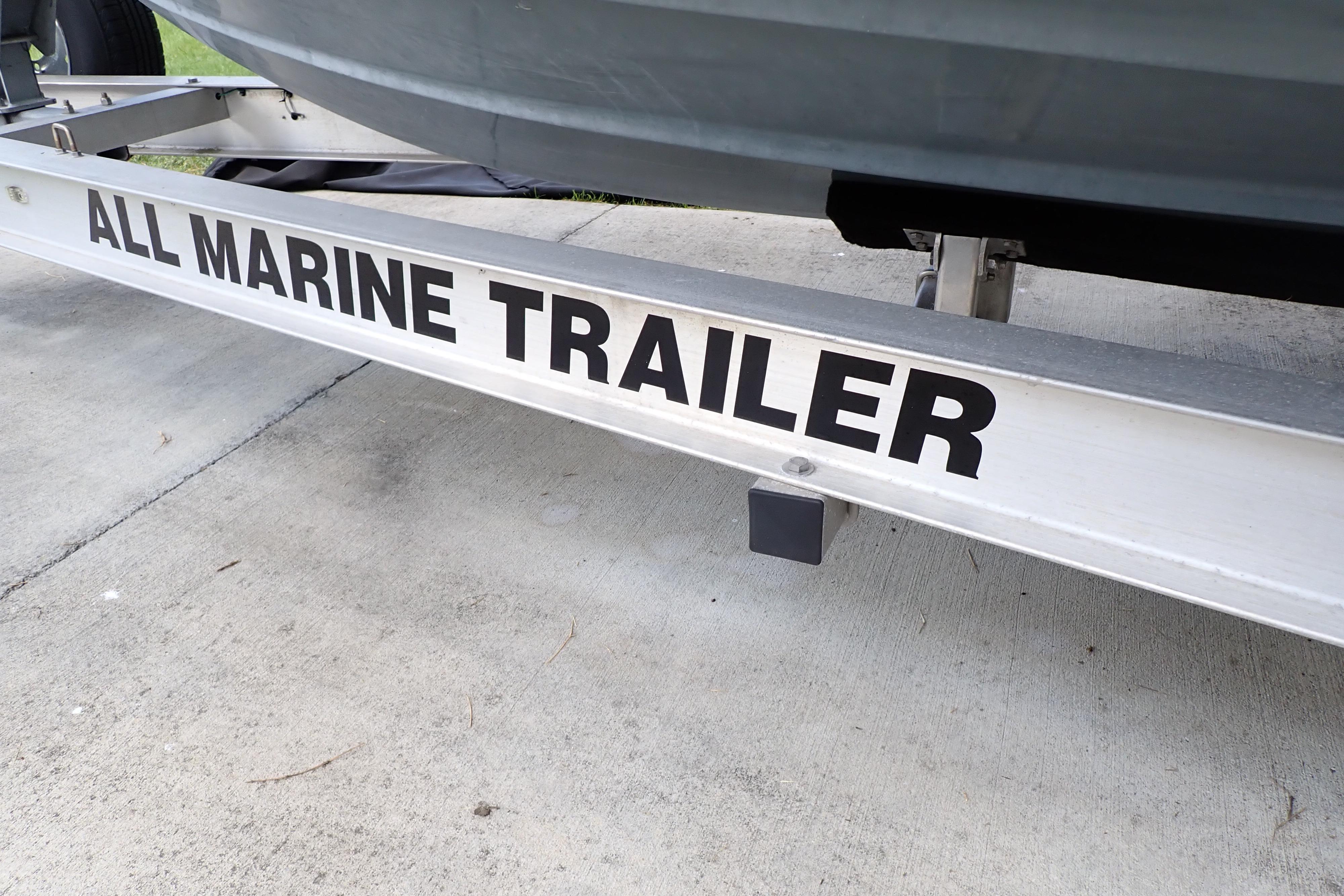 Trailer for 2019 Key West 263 FS boat on concrete surface.
