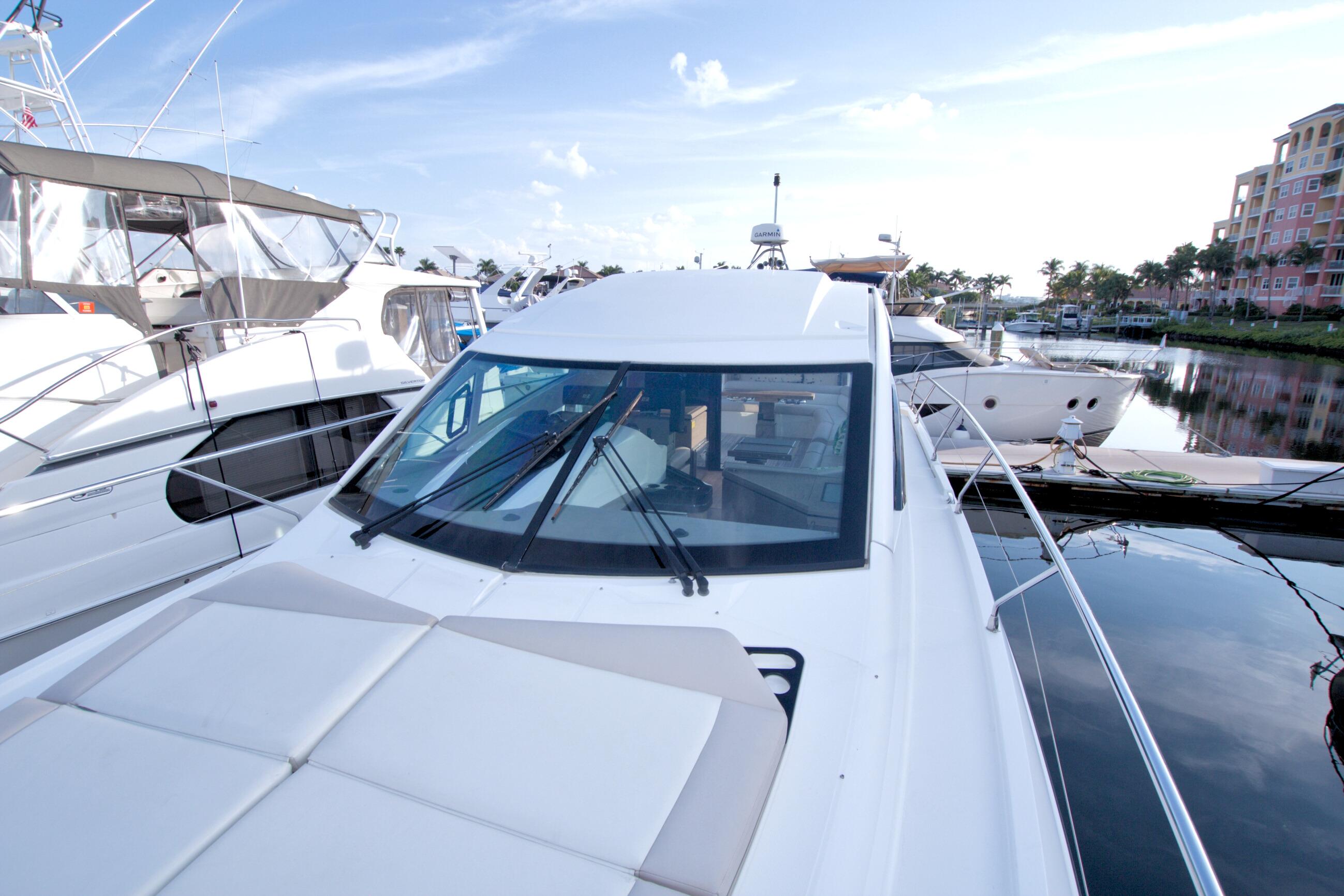 2019 Beneteau Gran Turismo 50 yacht docked at marina, showcasing sleek design and luxury features.