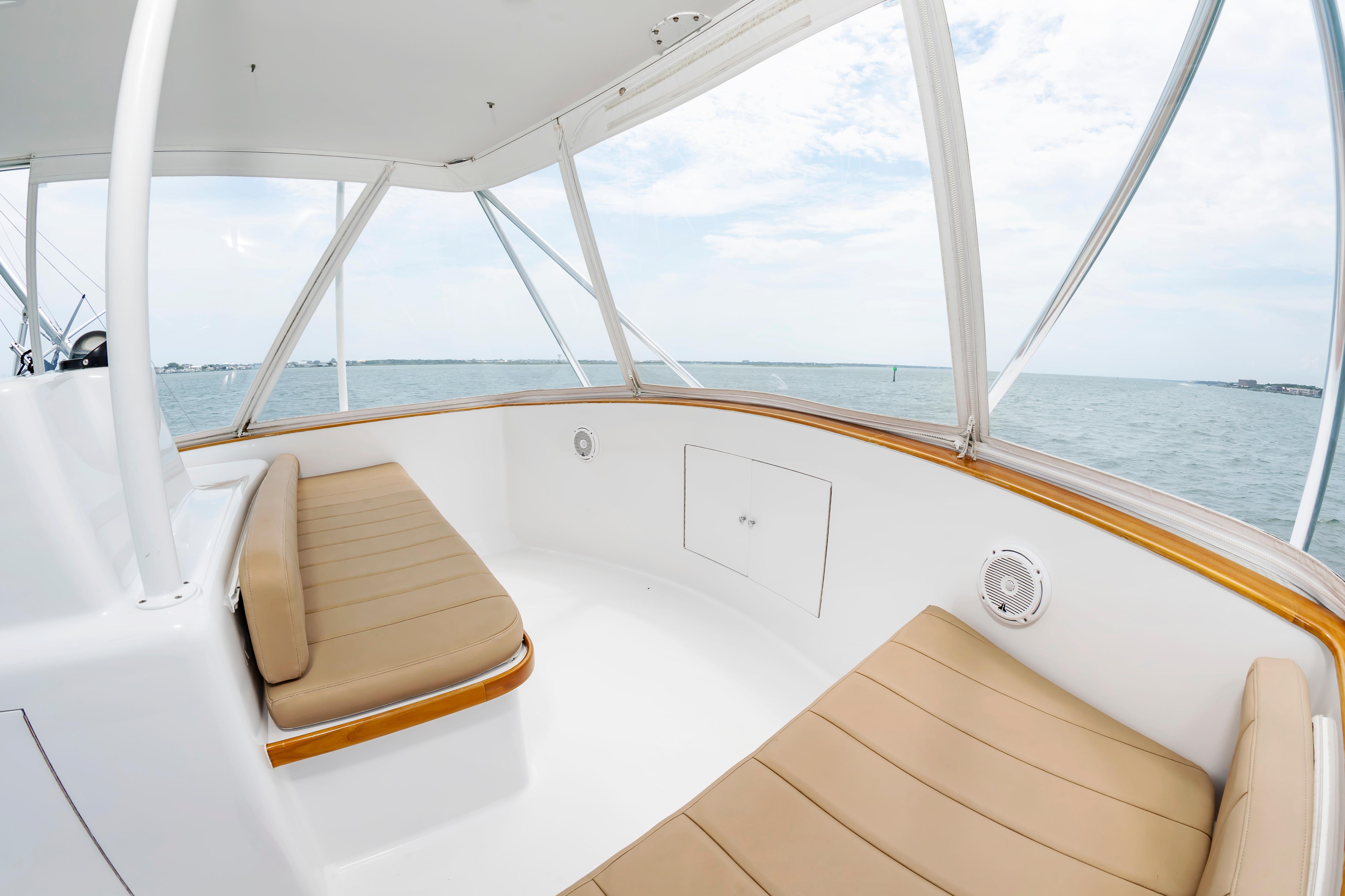Interior view of 1993 Custom Carolina Scarborough 56 Convertible yacht with beige seating.