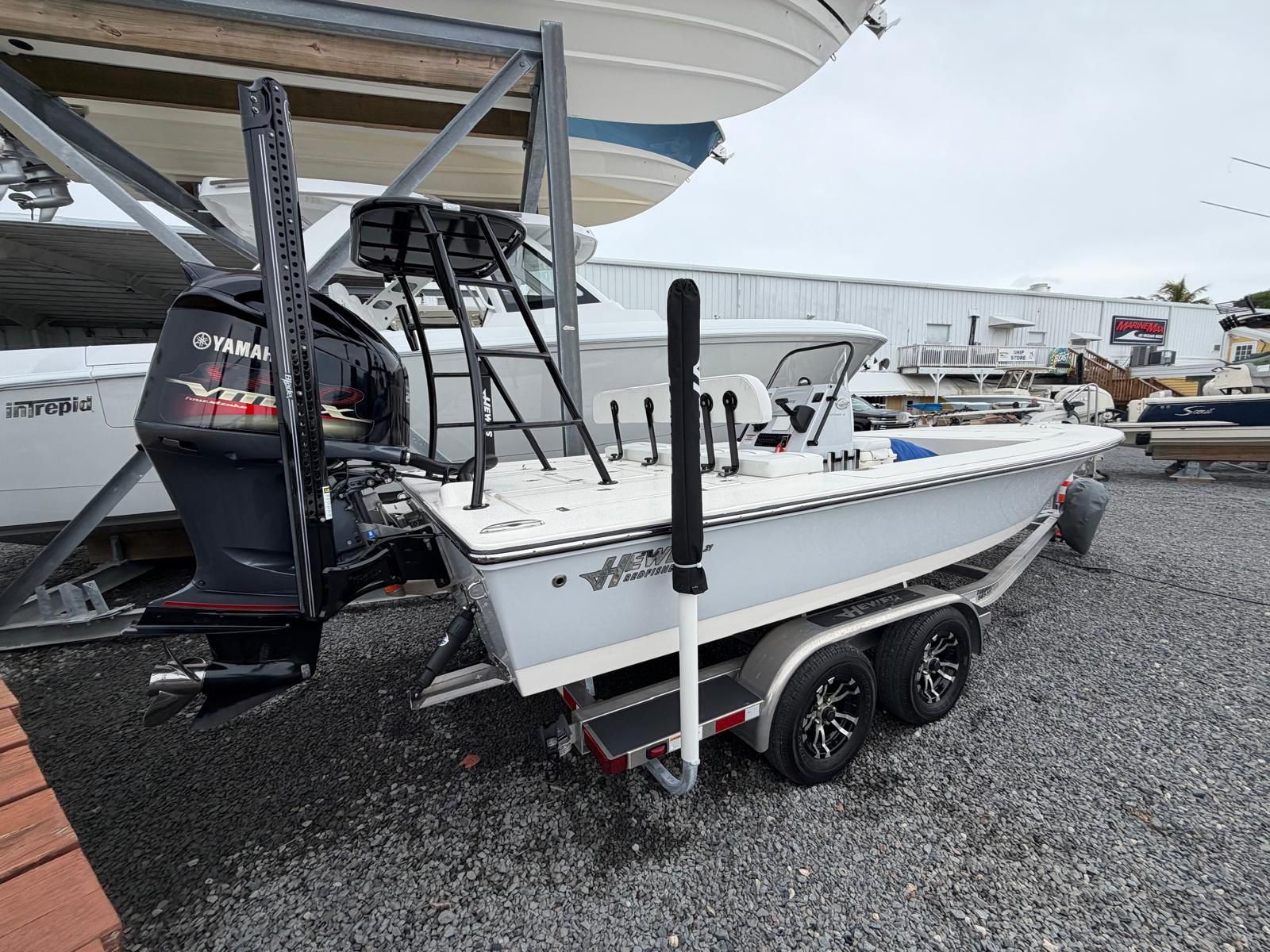 A 2022 Hewes Redfisher 21 boat on a trailer, featuring a Yamaha outboard motor.