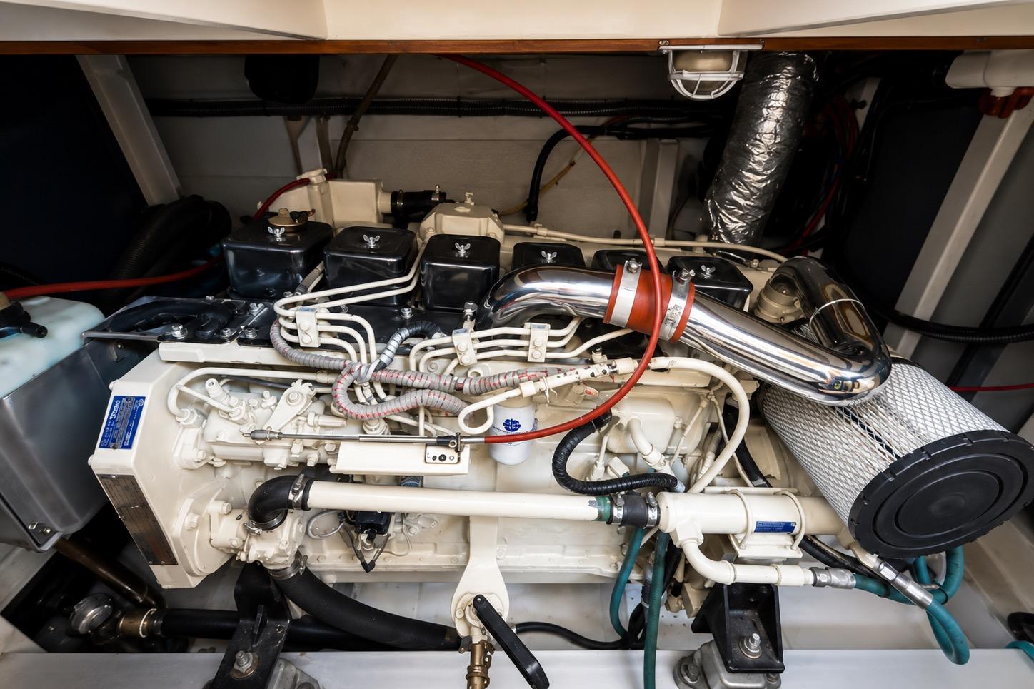 Engine room of a 1989 Grand Banks 42 Classic yacht, showcasing detailed machinery.