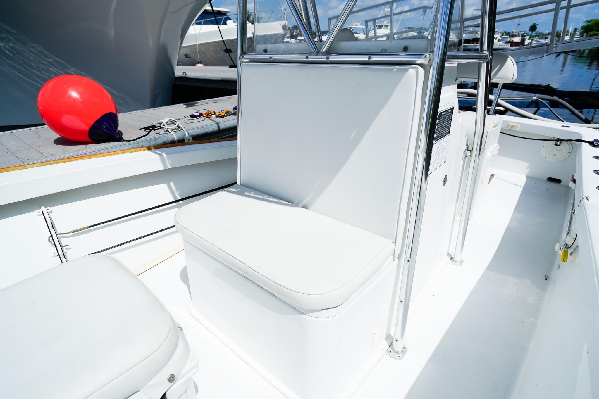 1977 Scarborough 27 CC boat interior with white seating and a red buoy.