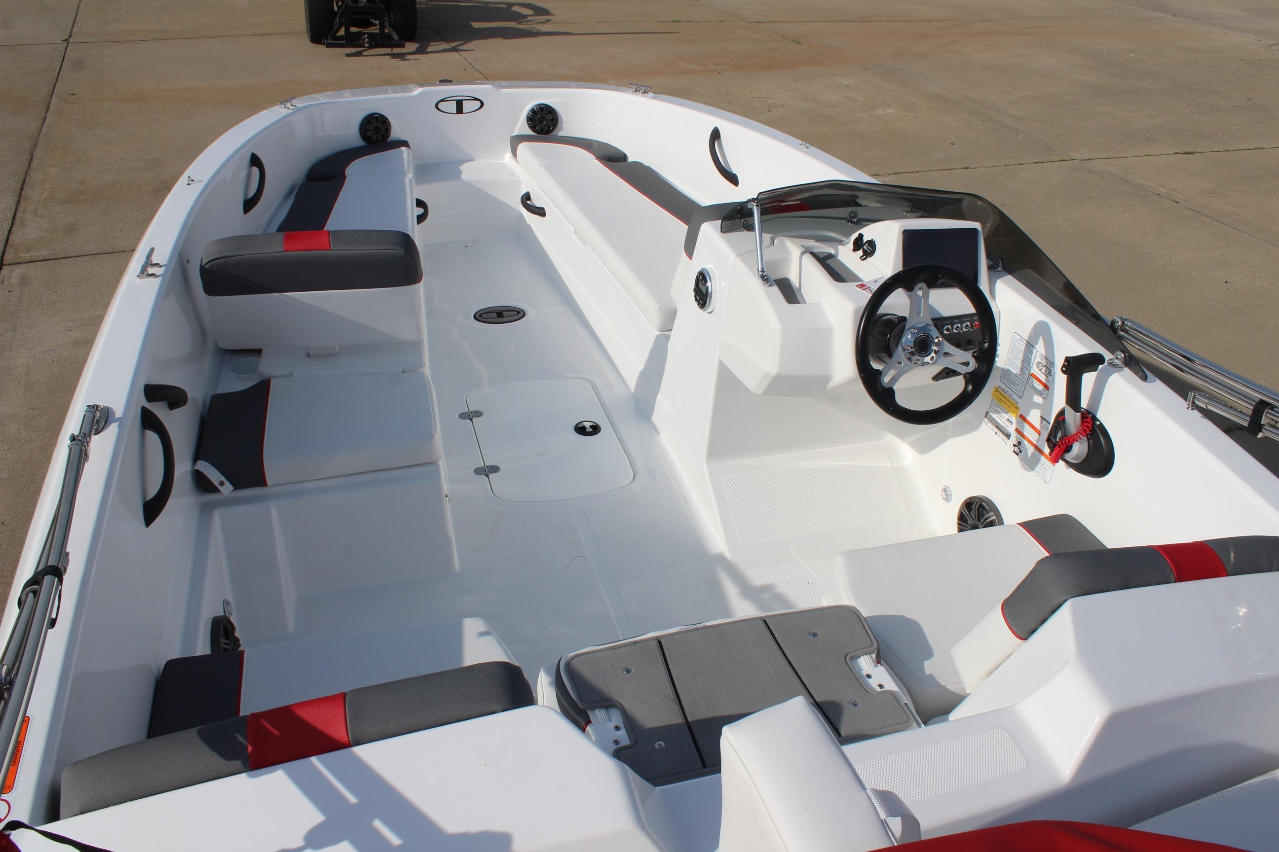 2026 Tahoe T18 boat interior with modern seating and steering wheel.