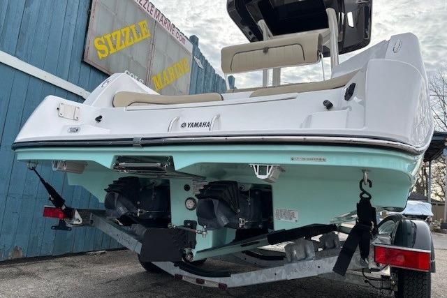 2026 Yamaha Boats 222 FSH Sport E on trailer, rear view, blue and white hull.