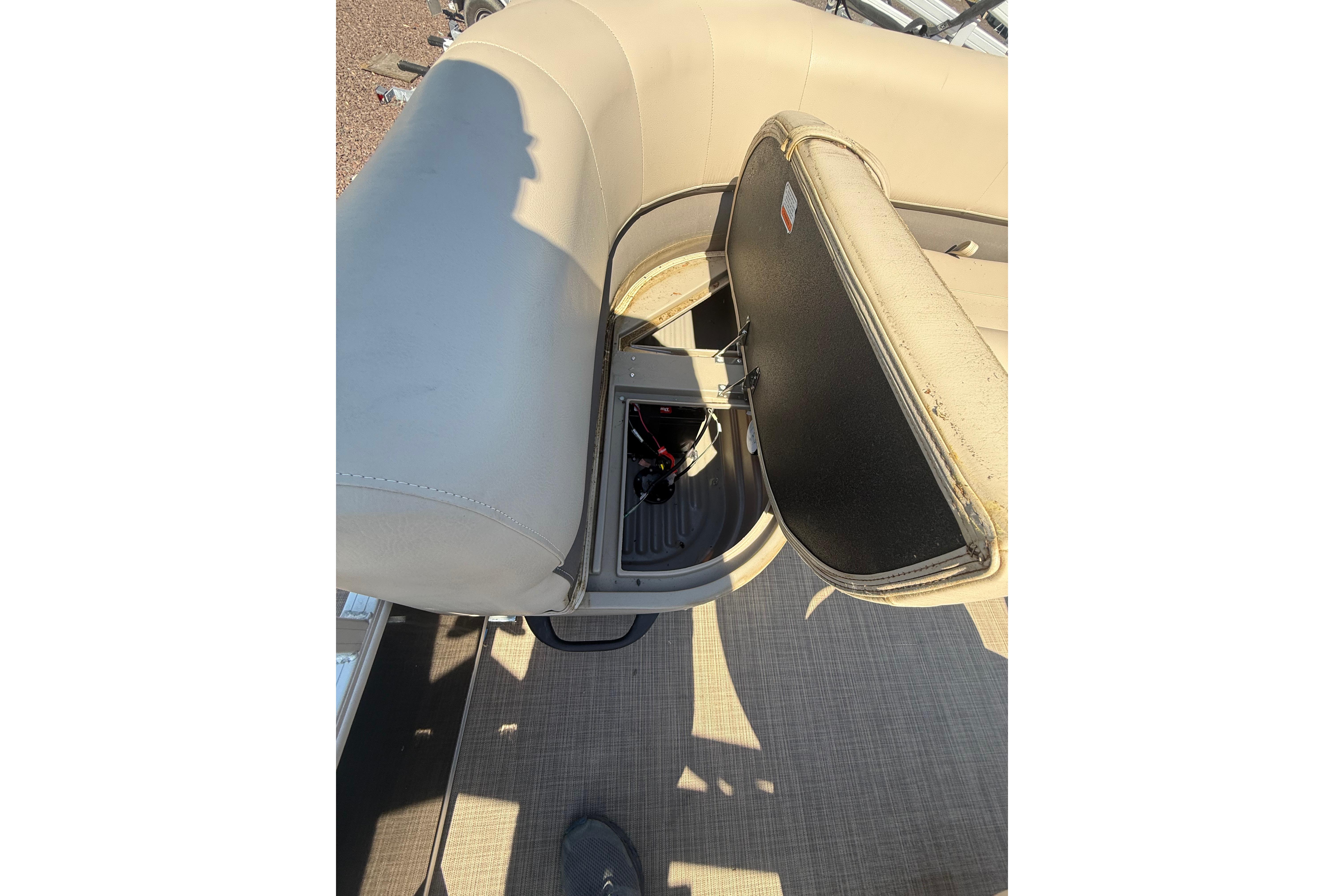 2021 Sun Tracker Bass Buggy 16 XL Select boat seat storage compartment open.