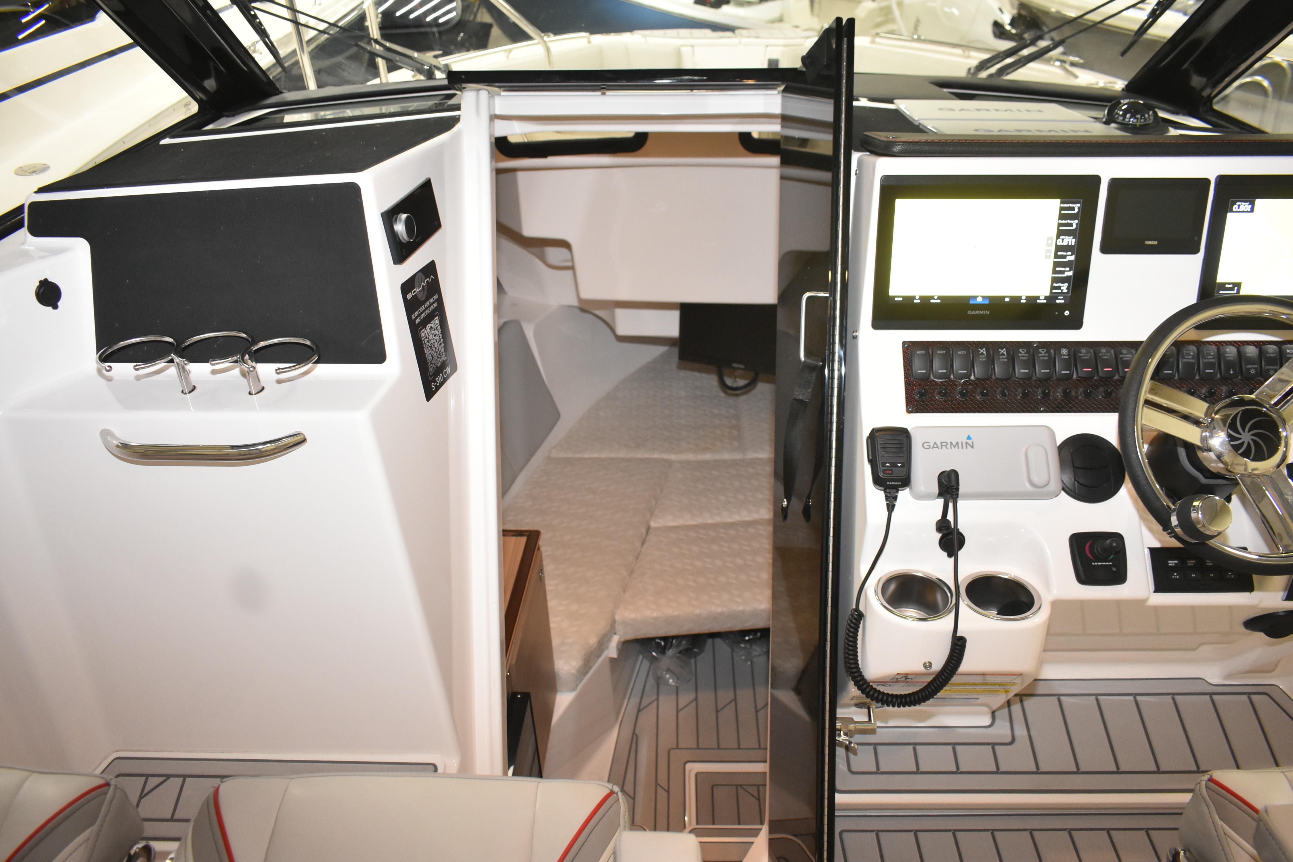 2025 Solara S-310 CW boat interior with modern dashboard and navigation equipment.