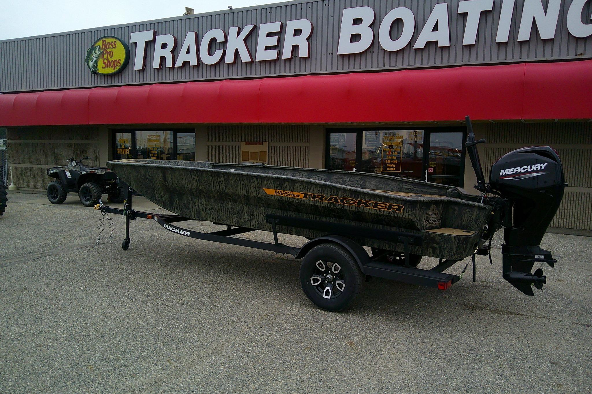 2026 Tracker Grizzly 1756 T Marsh boat outside Tracker Boating store with Mercury engine.