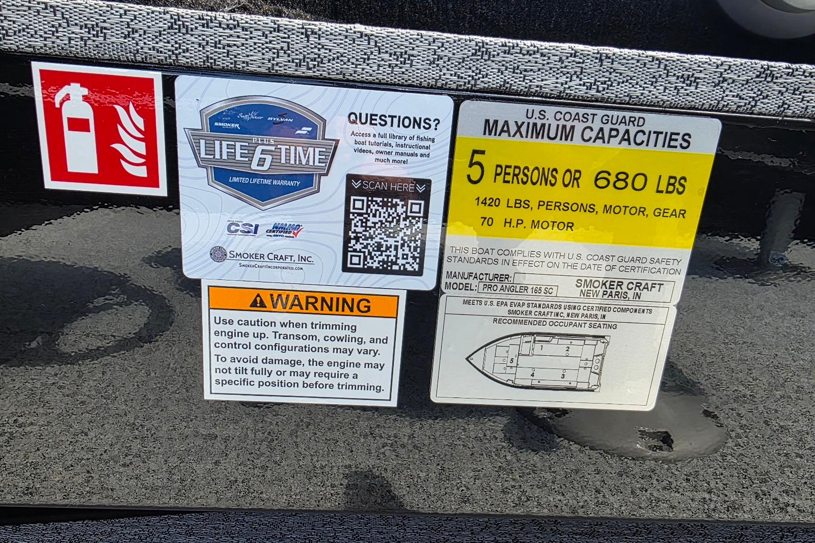 Smoker Craft Pro Angler 165 SC 2026 boat capacity and safety labels with QR code and warning.