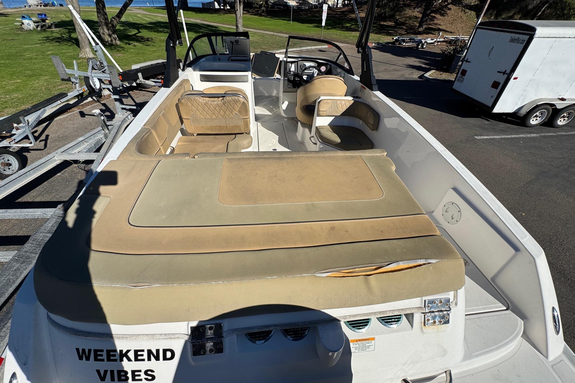 2022 Bayliner VR6 Bowrider OB with tan seating, parked on a trailer.