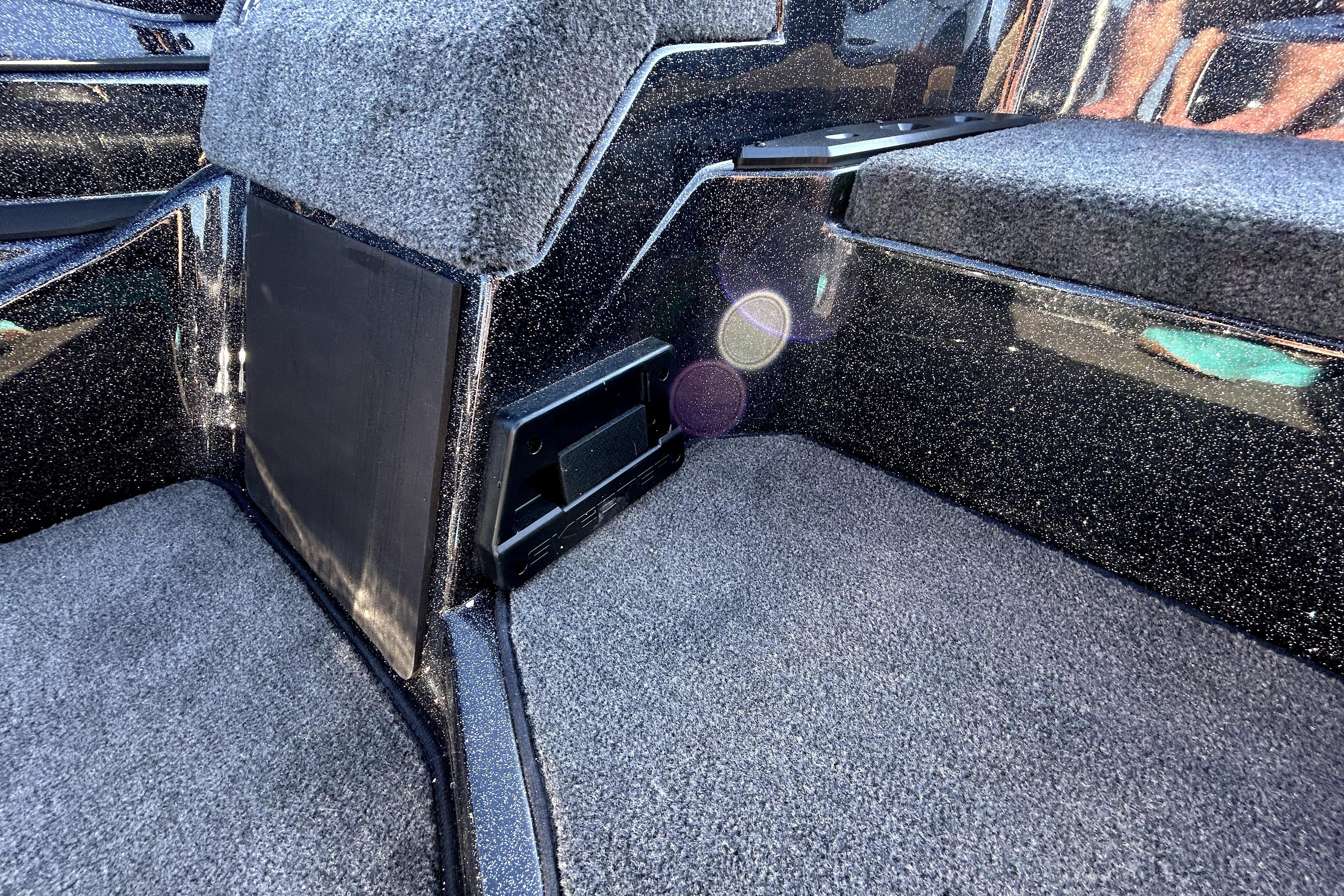Interior of 2026 Skeeter ZXE21 boat with carpeted flooring and sleek design.