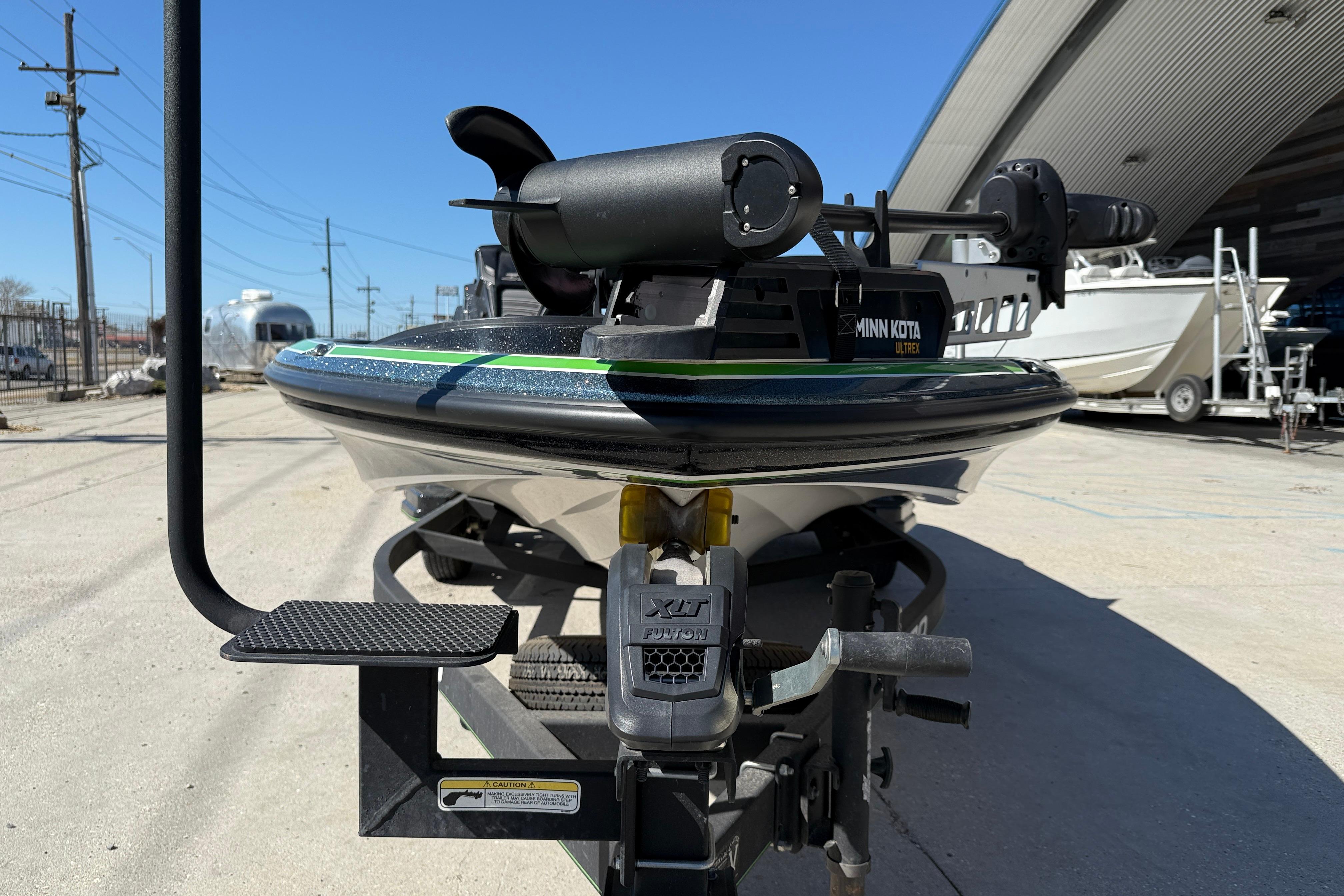 2020 Nitro Z20 boat with Minn Kota Ultrex motor on trailer, parked outdoors.