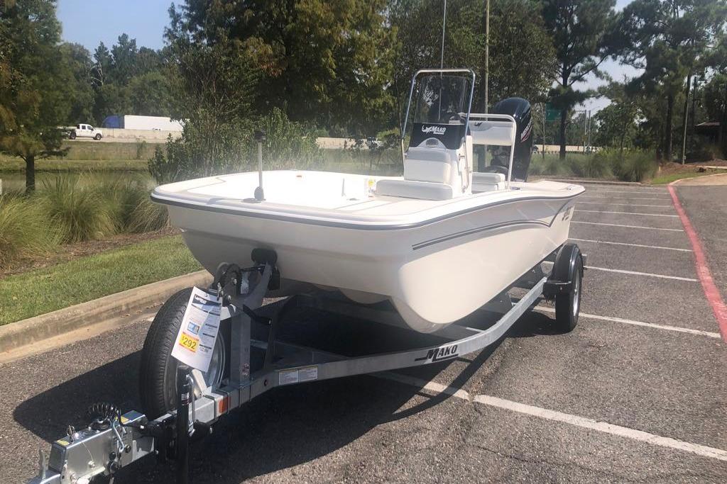 2026 Mako Pro Skiff 17 CC boat on trailer in parking lot.