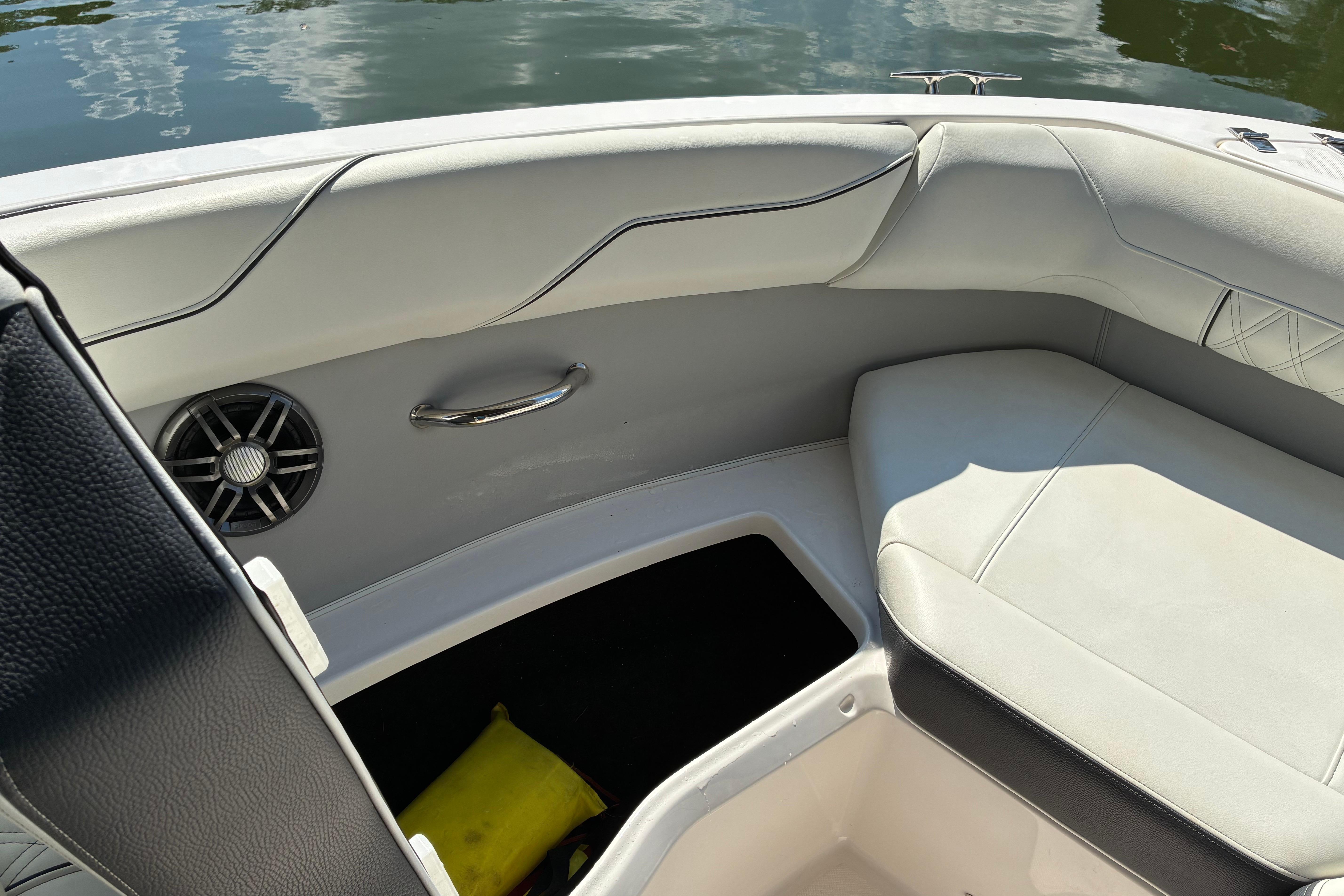 Interior of 2025 Regal LS2 boat with white seating and speaker detail.