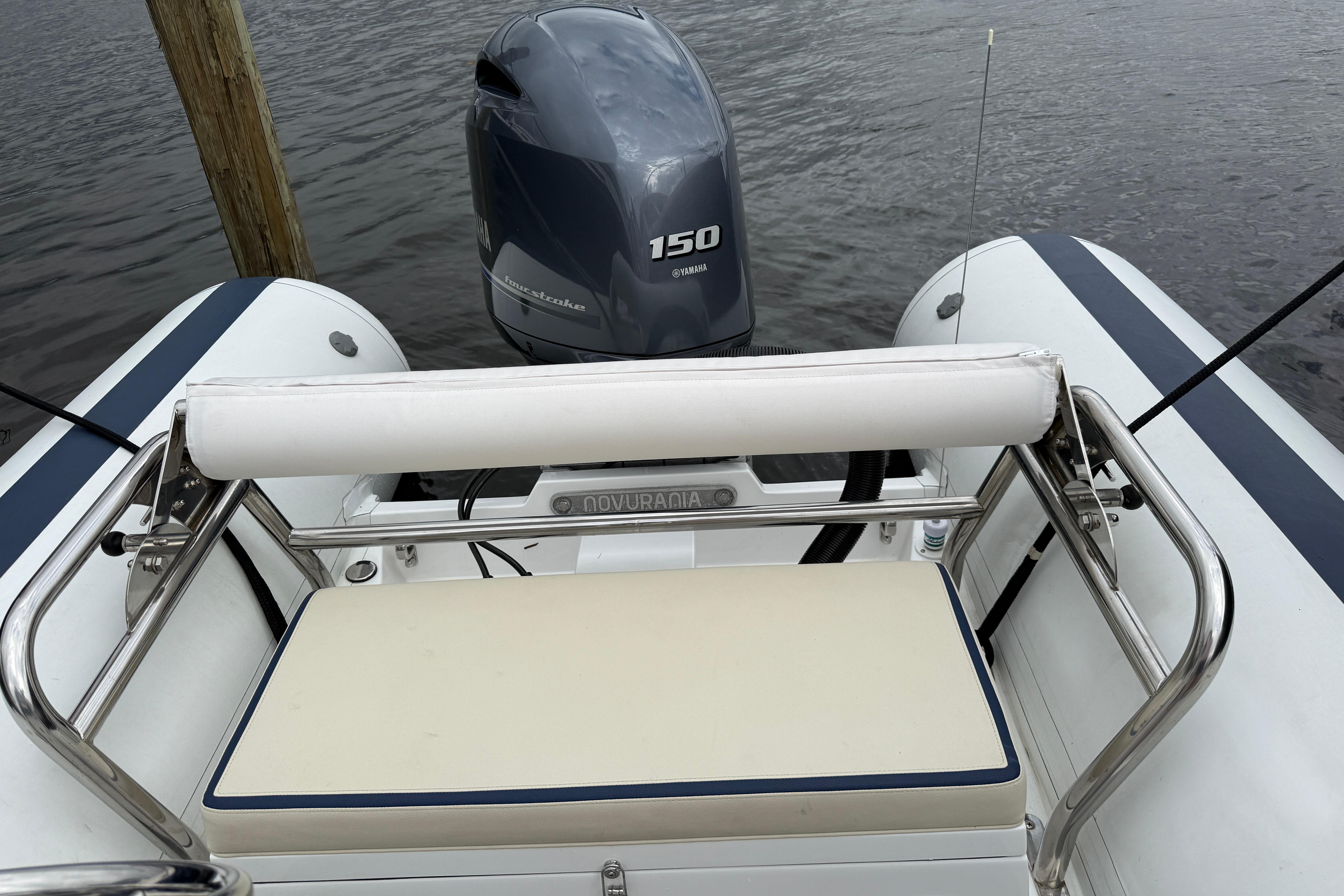 2024 Novurania Catamaran 20 with Yamaha 150 engine, docked on calm water.