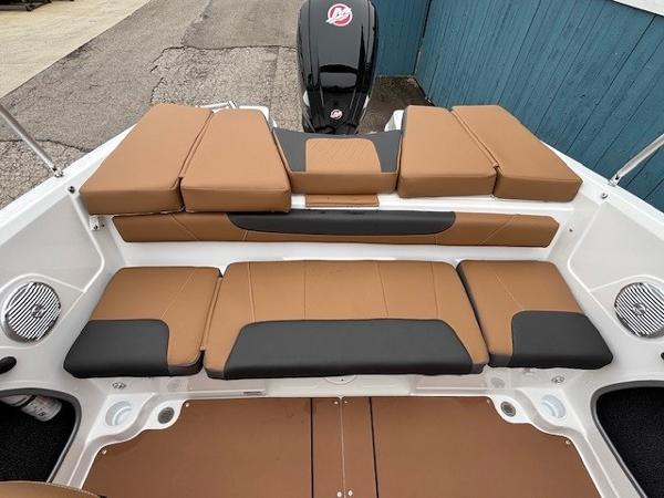 2025 Tahoe 185 S boat interior with tan and black seating, showcasing modern design.