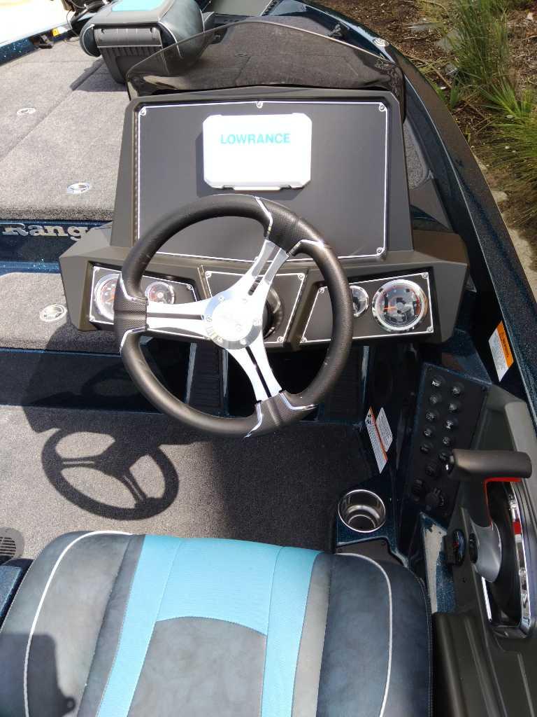 2025 Ranger Z518 boat dashboard with steering wheel and Lowrance display.