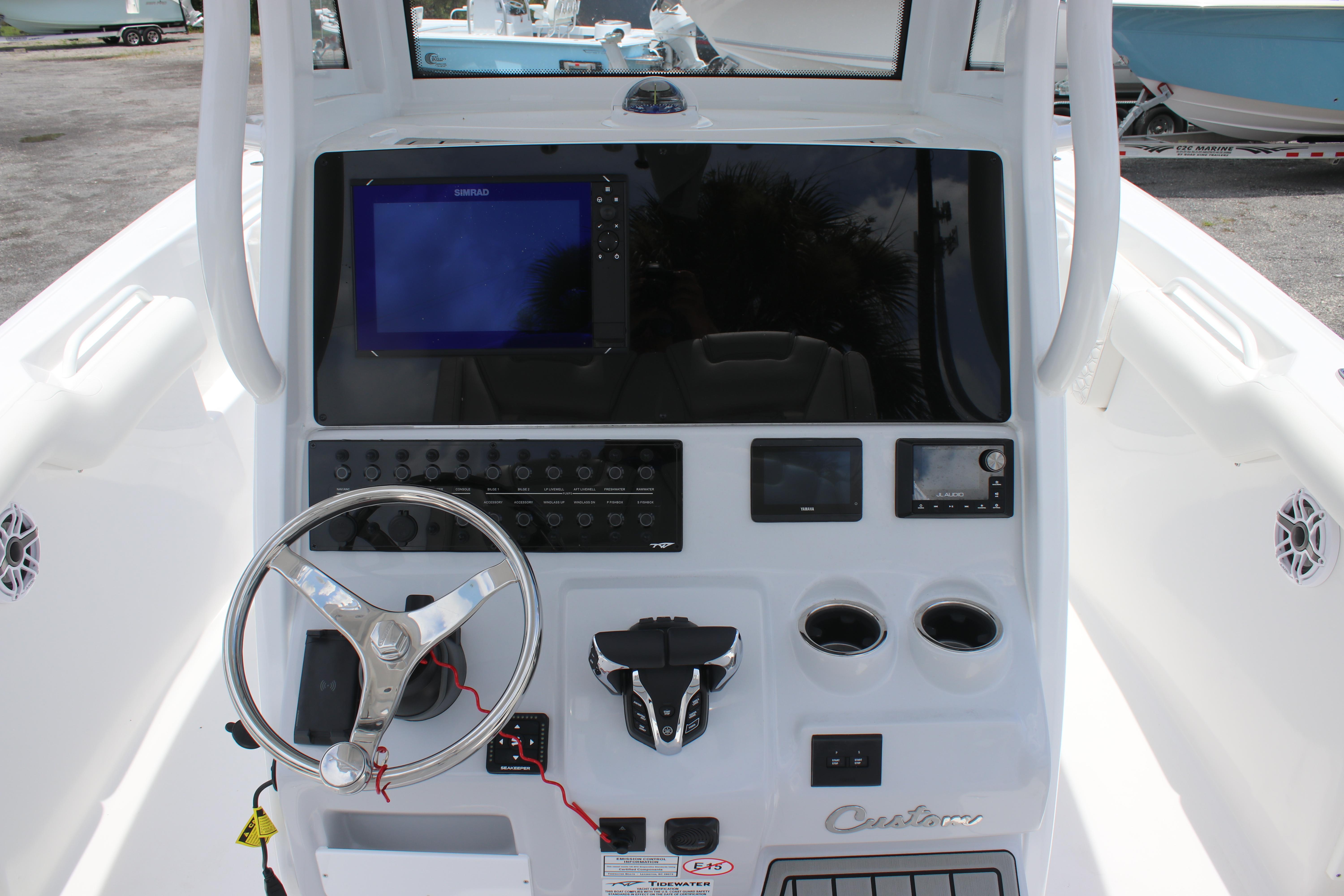 2026 Tidewater 272 LXF boat dashboard with steering wheel and electronic controls.