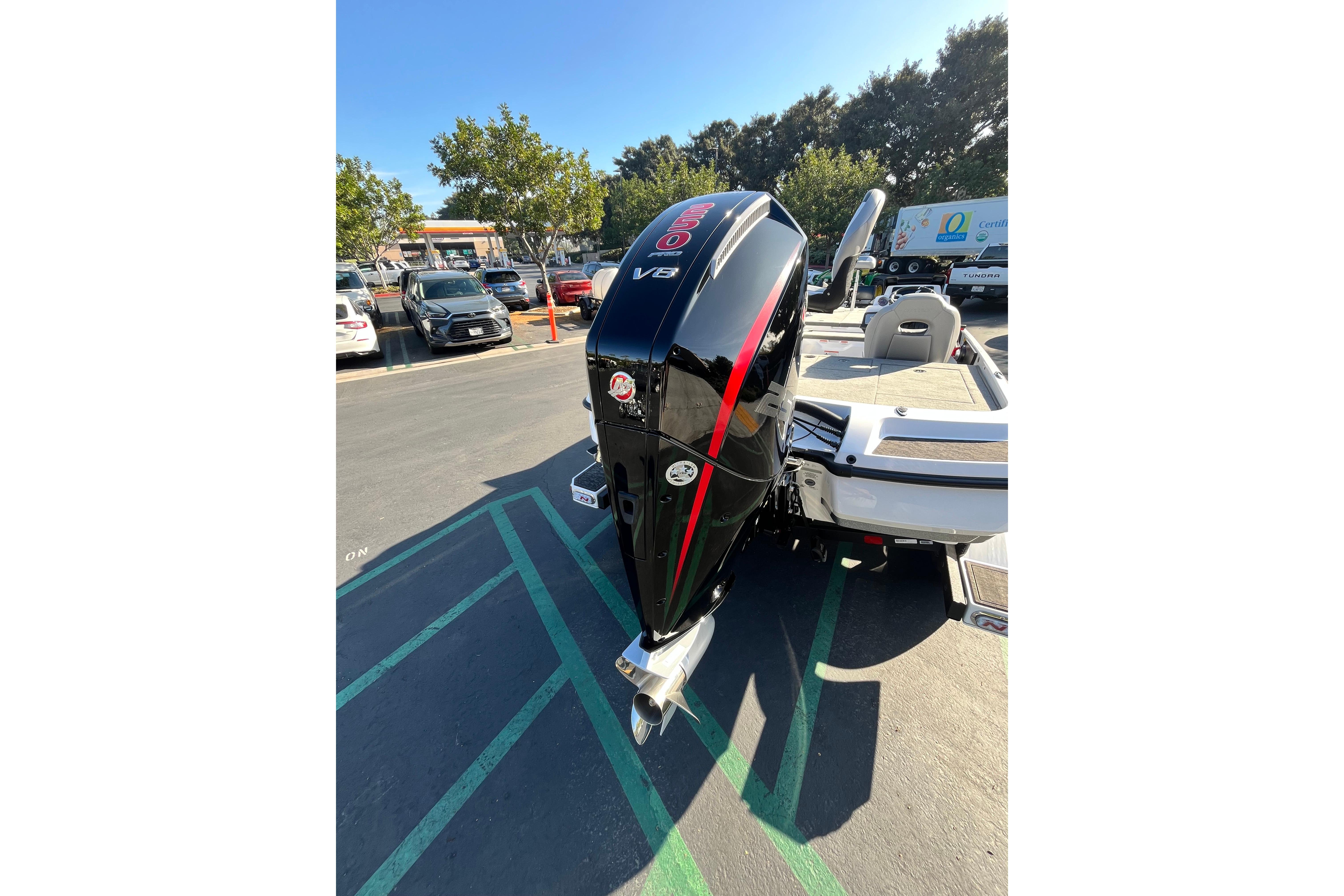 2026 Nitro Z21 XL Pro boat with powerful V8 engine in a parking lot.