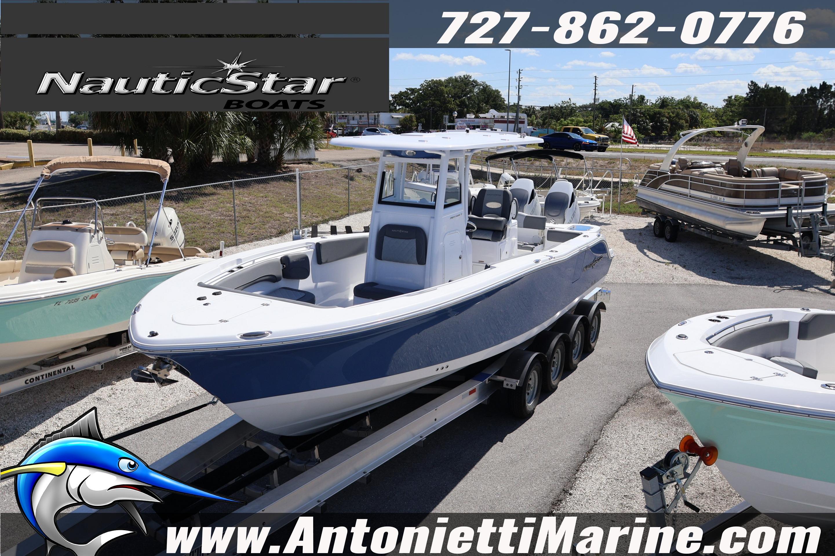 2026 NauticStar 292 Legacy boat on trailer at dealership, surrounded by other boats.