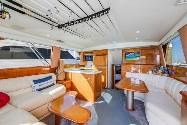 Luxurious interior of a 1999 Viking 47 Convertible yacht with elegant seating and modern amenities.
