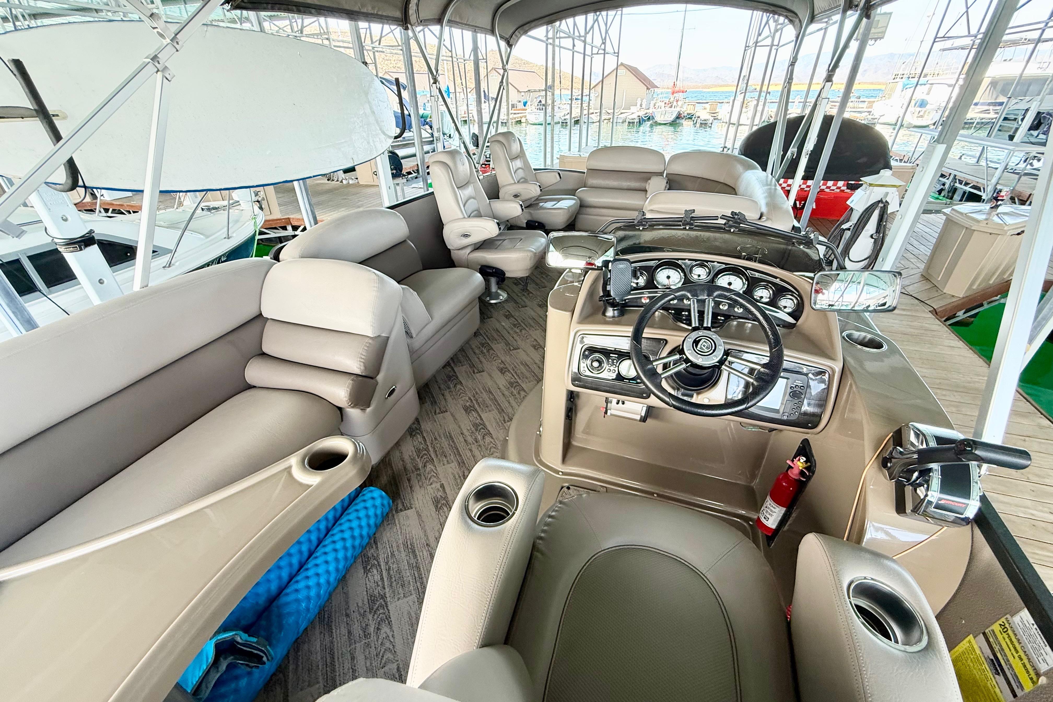 2011 Premier 275 Grand Majestic PTX pontoon boat interior with luxurious seating and modern dashboard.