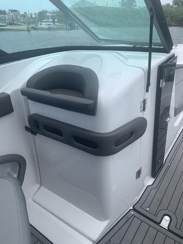 2020 Rinker 29QX BR boat interior with helm station and windshield.