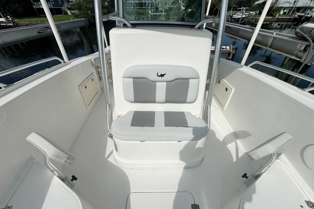 2018 Mako 284 Center Console boat interior with seating and storage compartments.