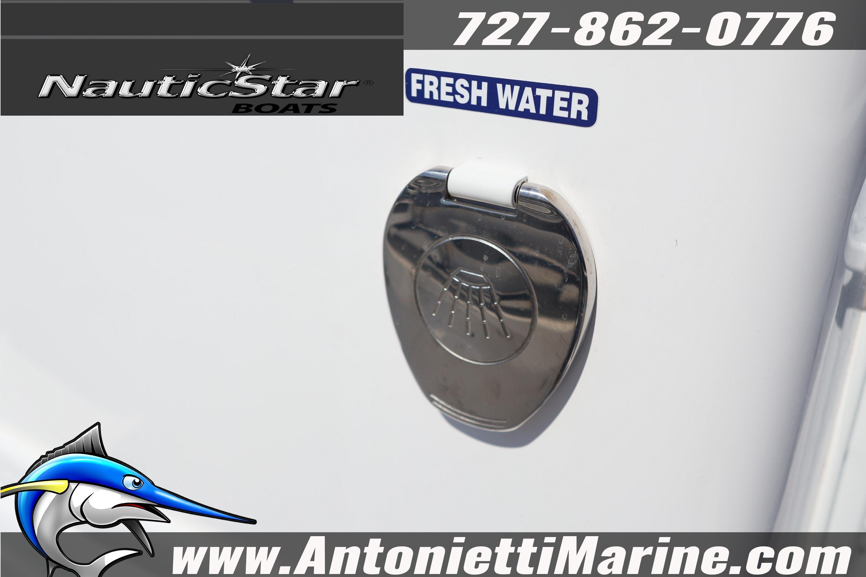 NauticStar 292 Legacy 2026 boat with fresh water access and contact details.