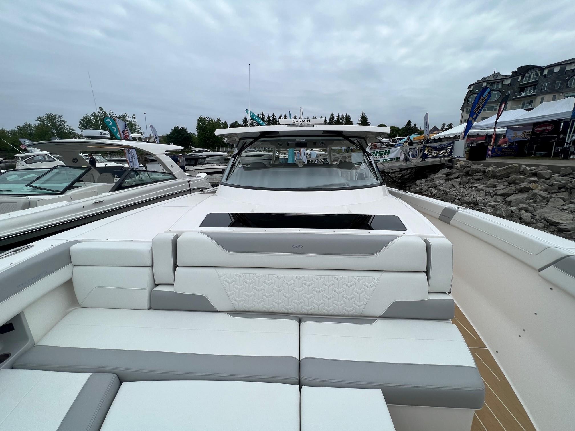 2026 Regal 50 SAV luxury boat with sleek design at a marina.