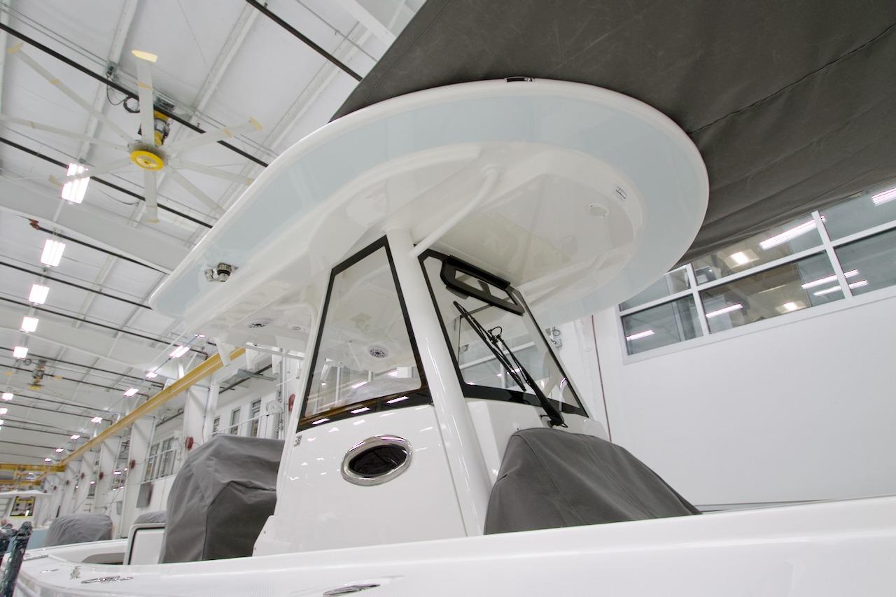 2026 Regulator 31 boat in a modern indoor facility, showcasing sleek design and craftsmanship.
