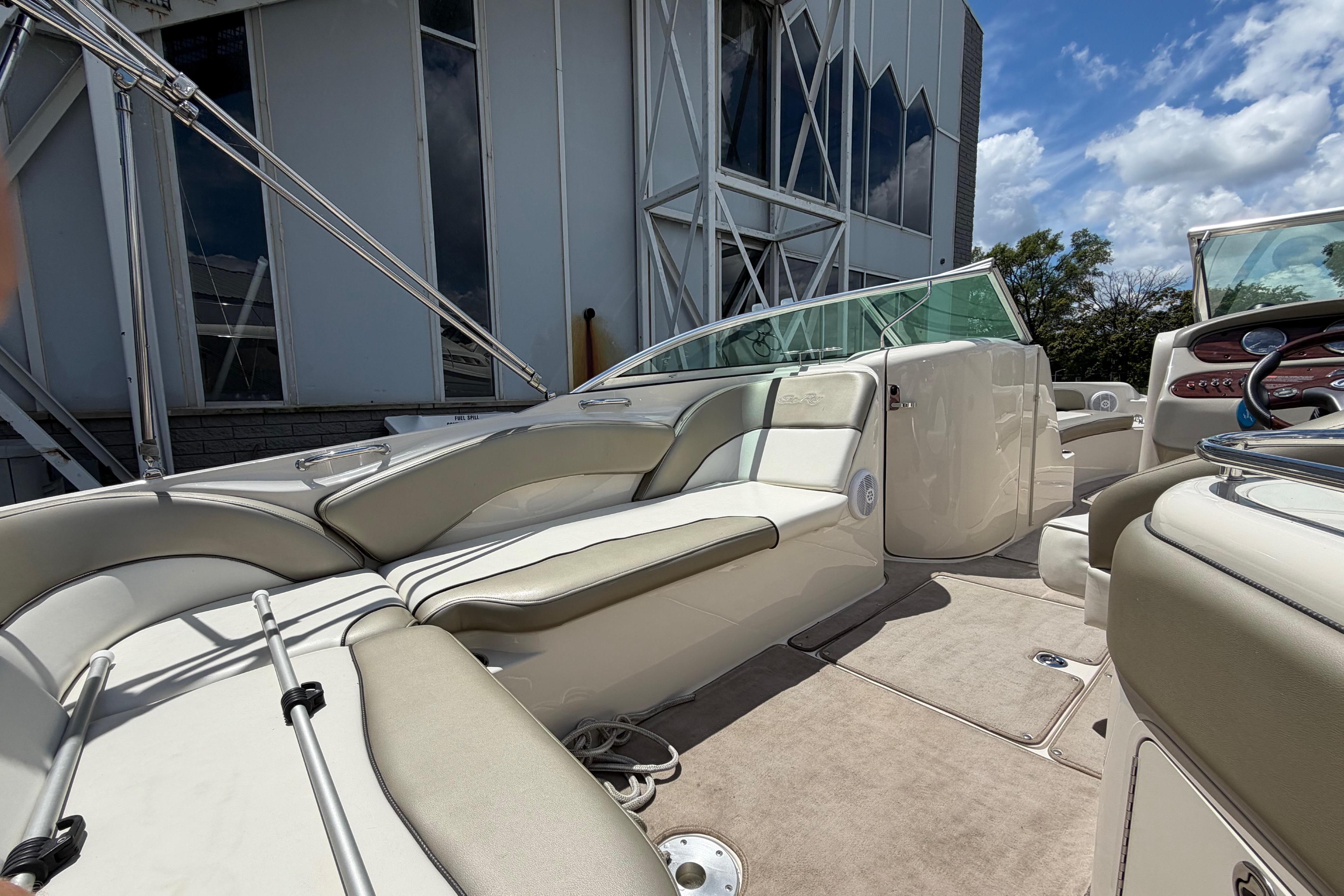 2004 Sea Ray 240 Sundeck boat interior with beige seating and modern design.