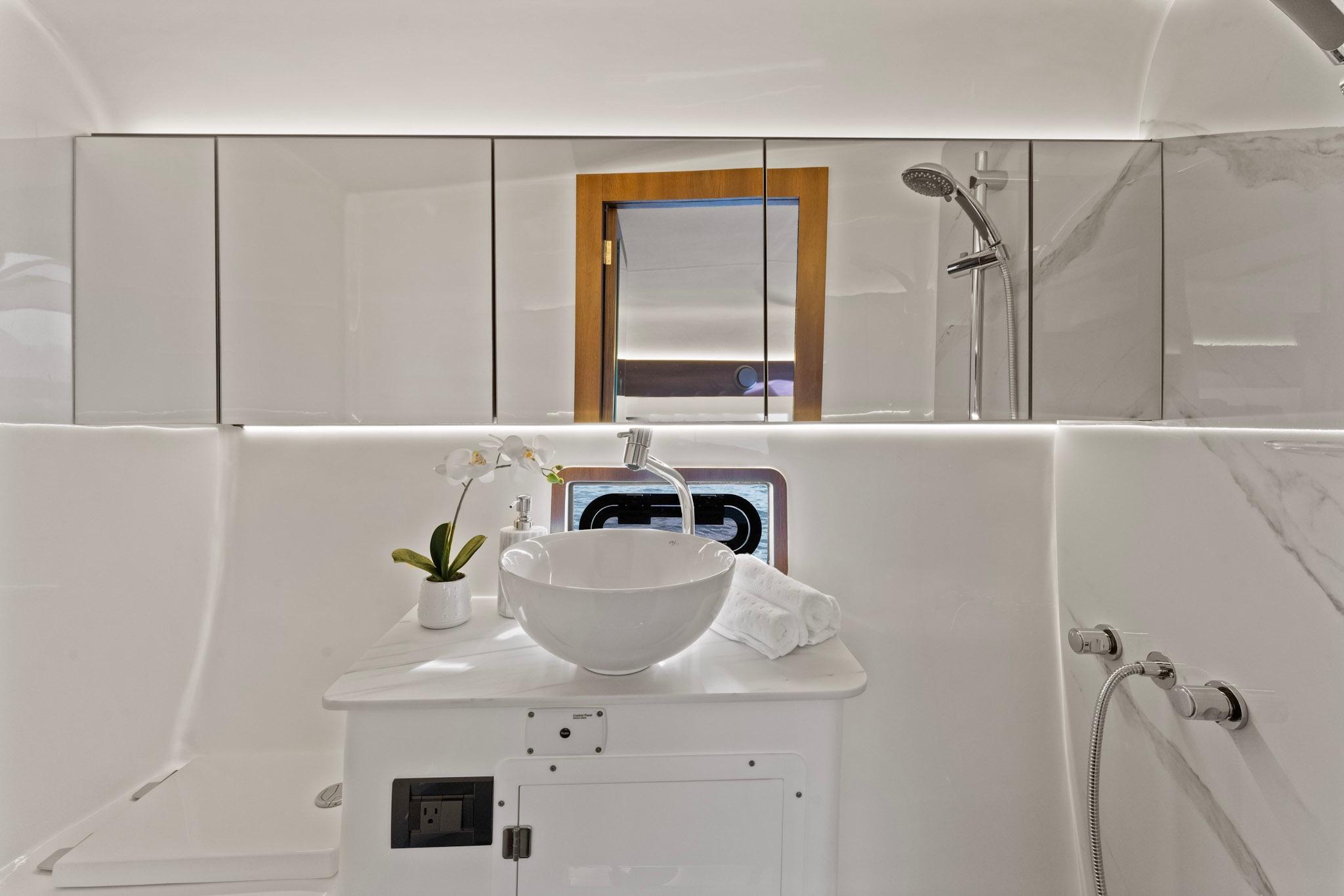 Luxurious bathroom interior of 2025 Valiatt 380GT yacht with modern fixtures and elegant design.