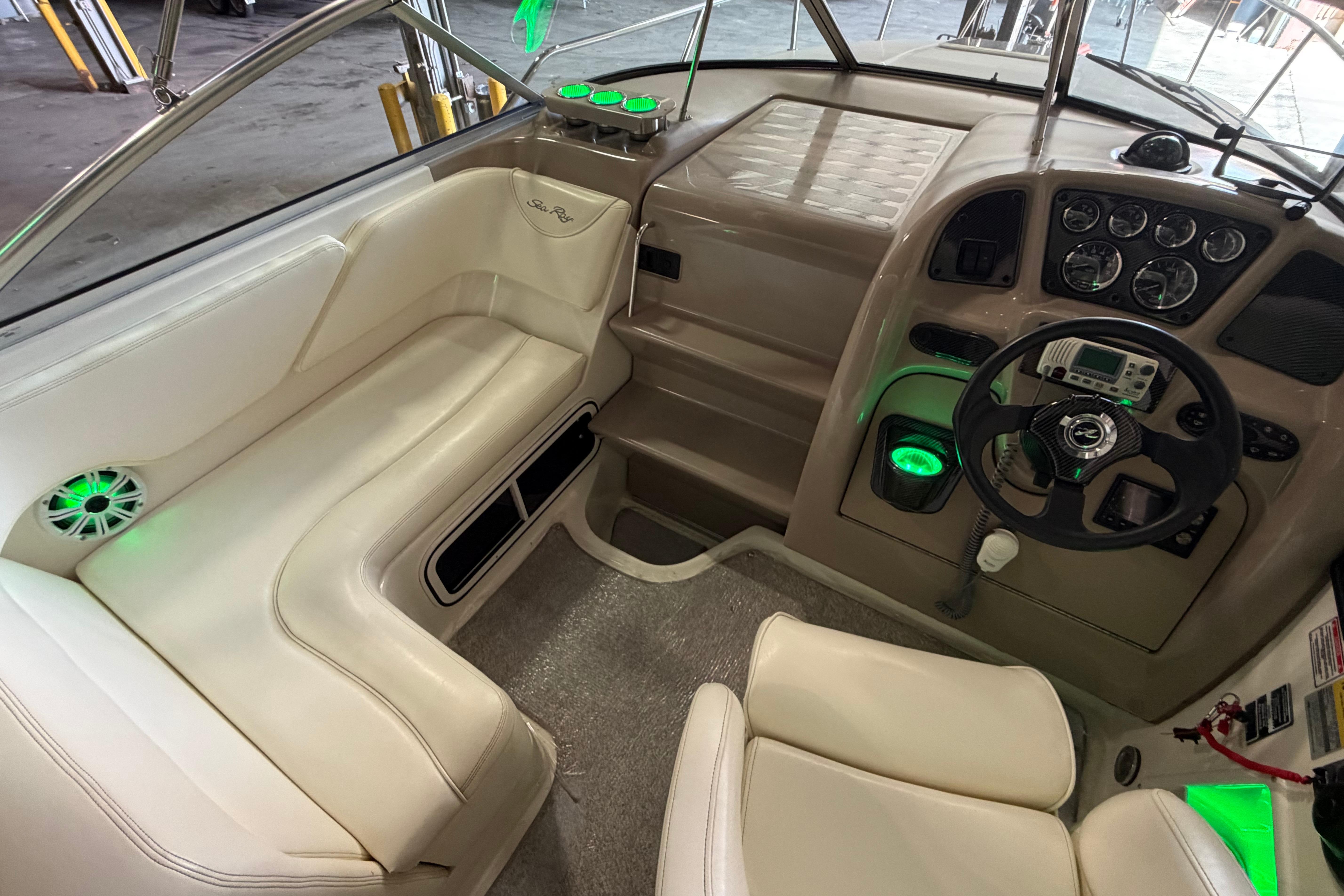 Interior of a 2004 Sea Ray Sundancer 260 boat with modern dashboard and seating.